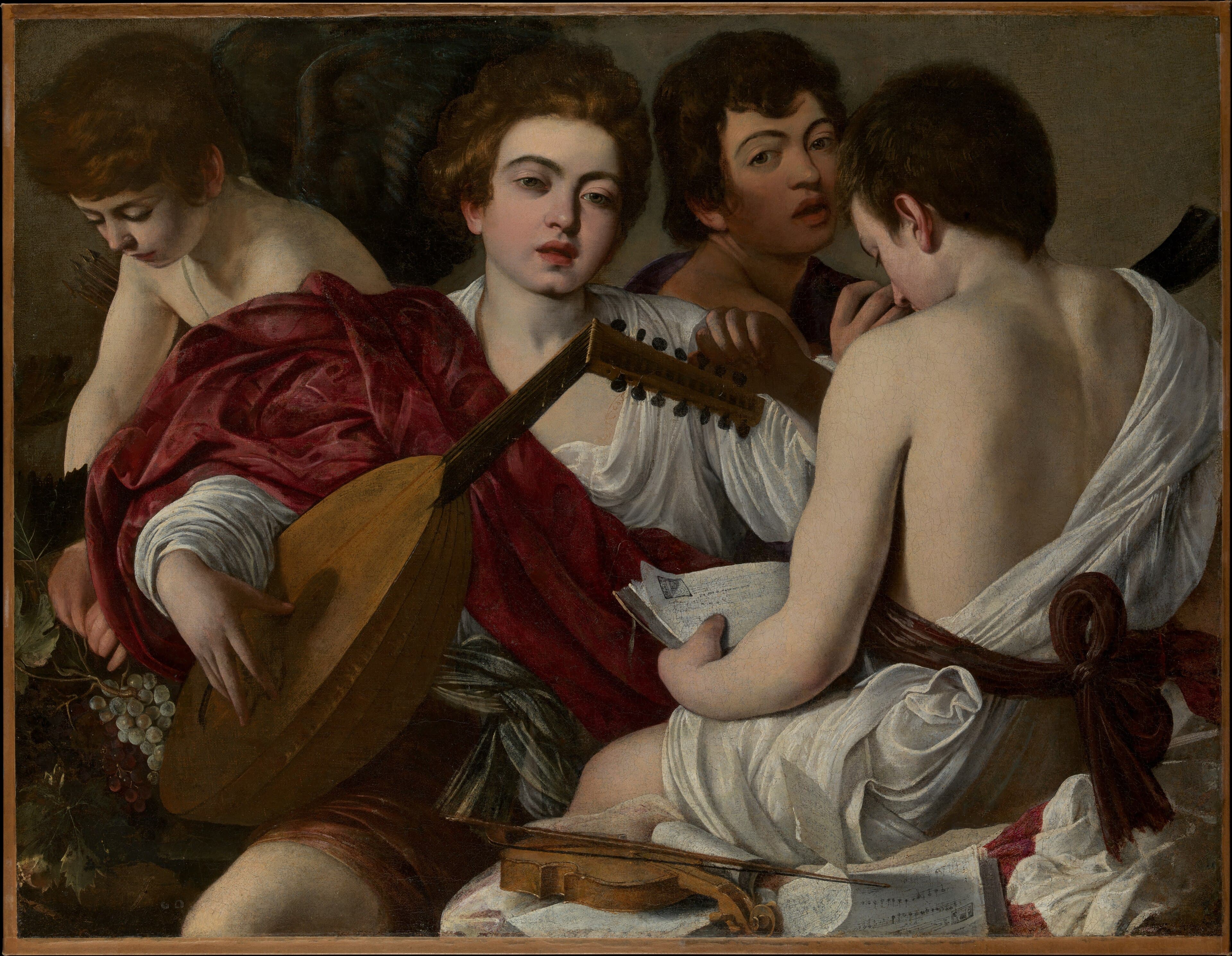 Four young men crowded together against a plain grey-brown wall. At the left a boy with bowed head and a sheaf of arrows behind his shoulder sits beside a heap of grapes and vine leaves. Beside him a youth in crimson drapery over a white shirt plays a pear-shaped lute and looks out at the viewer; behind them a dark-haired boy sings with his mouth open. In the foreground on the right a fourth boy is seen from behind, bare-backed, a white drape falling from his shoulder and a dark red sash tied in a large bow, his head bent over an open book of music. A violin and its bow lie on loose sheets of written music at the bottom, and a dark curved horn stands at the right edge