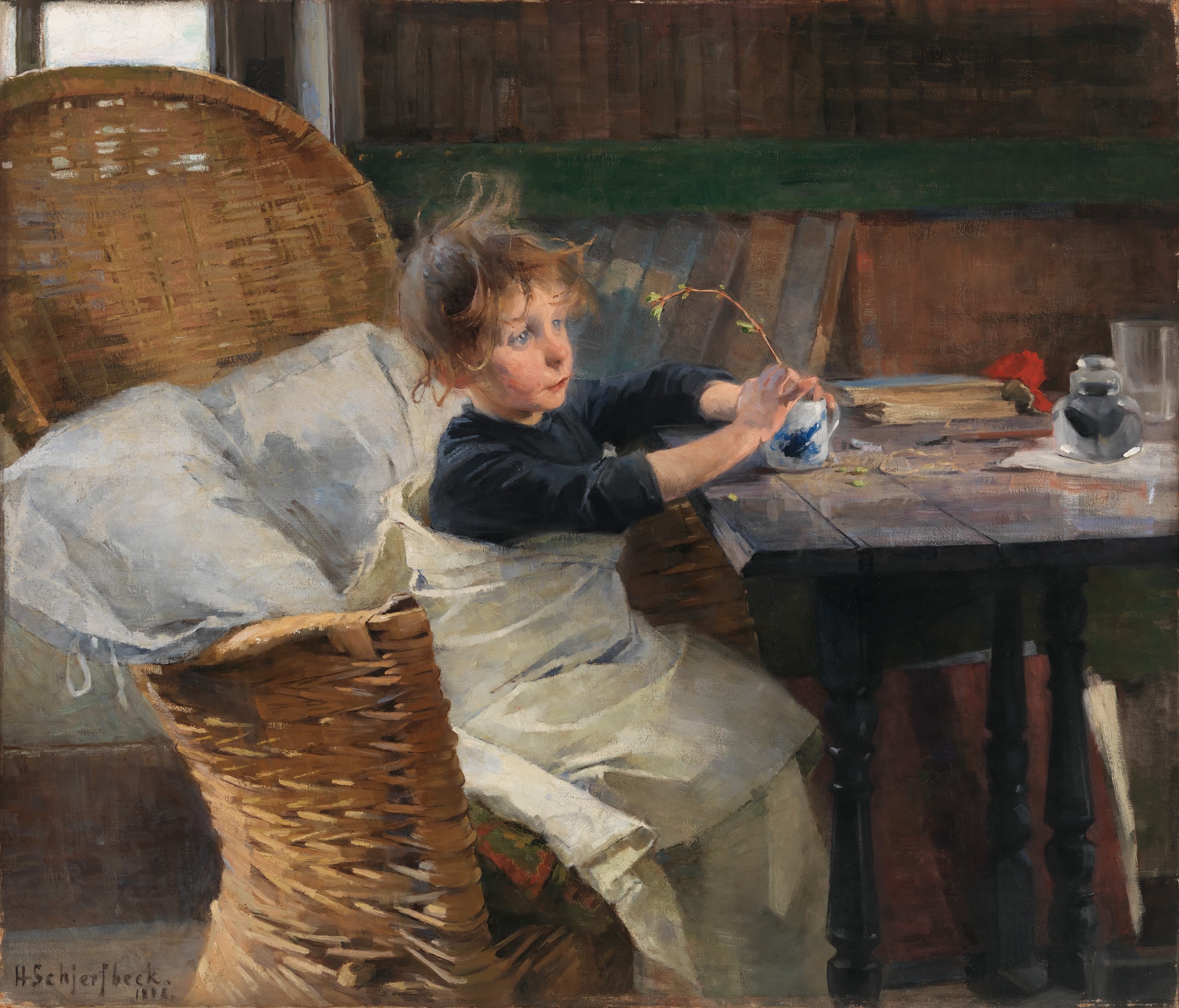Helene Schjerfbeck's The Convalescent: a small girl with tousled red-brown hair sits sideways in a tall woven rattan chair, propped on a white pillow with a white blanket over her lap and a dark blue top, holding a thin twig with green buds upright in a blue-and-white cup on a dark wooden table that also carries a red cloth, a brown book, an ink bottle on white paper and a glass, with a brown wooden wall and a shelf of leaning books behind and a bright window at the top left