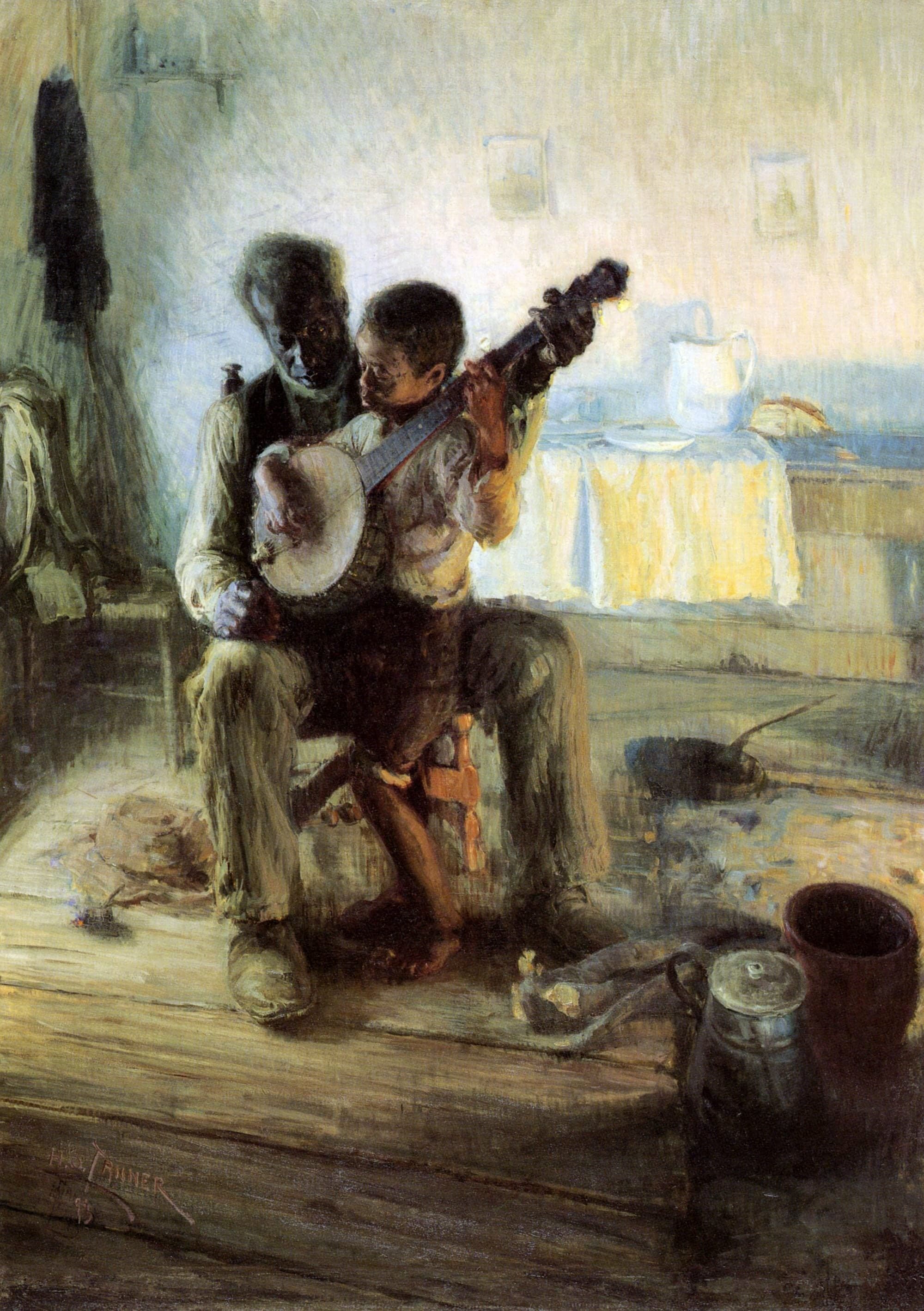 An elderly Black man sits on a plain wooden chair with a boy on his knee. The boy holds the neck of a banjo in his left hand and reaches across the strings with his right, while the man's left hand cups the round body of the instrument and he looks down at the boy's fingers. The wall behind them is washed in cool blue-white light, with a dark coat on a nail and a shelf at the upper left and two small pictures pinned up. At the right a table with a white cloth, a white jug, a plate and a loaf glows in warm yellow light. On the floorboards are a felt hat and a pipe at the left, and a skillet, a lidded coffee pot, a tall stoneware crock and a bundle of cloth at the right