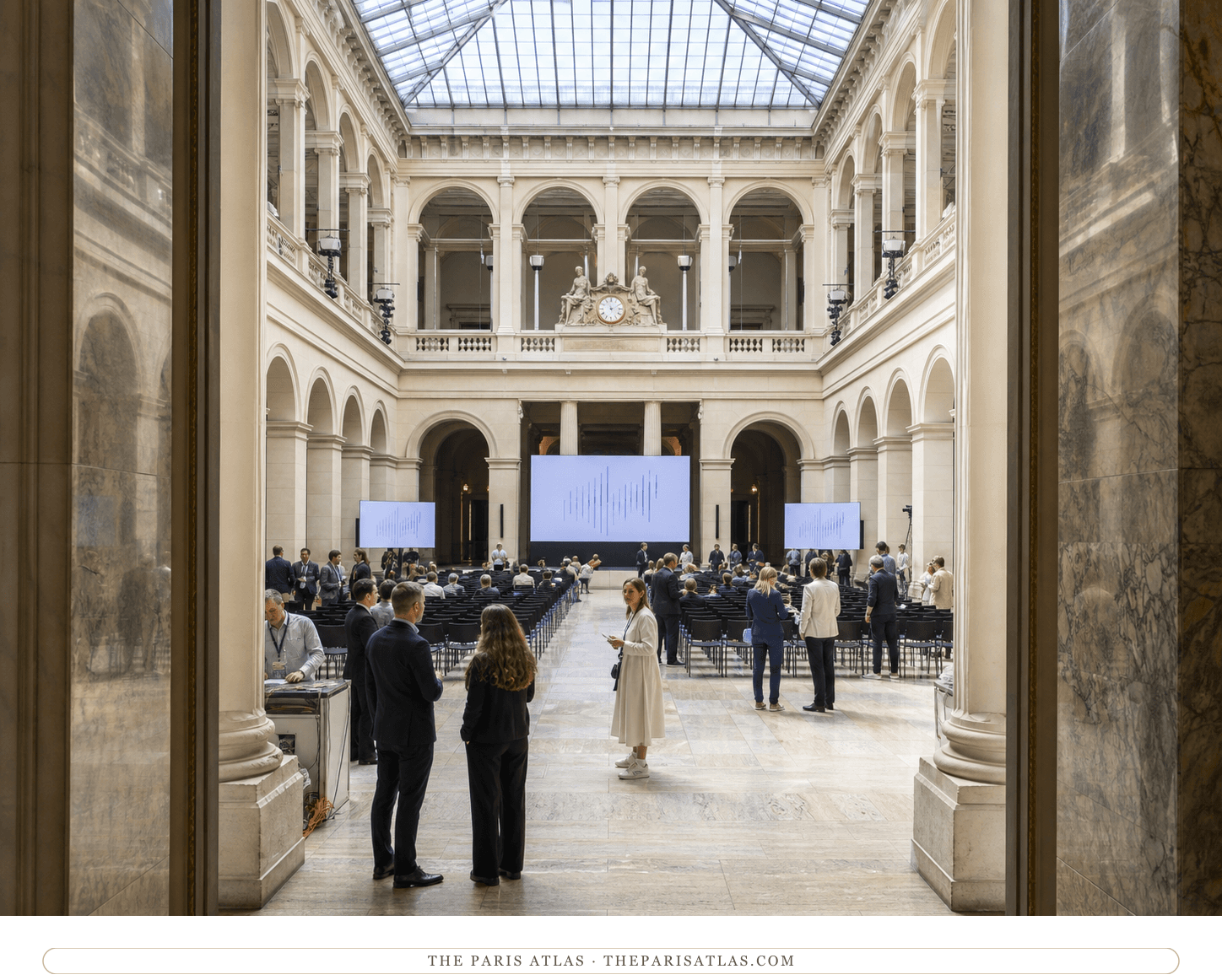 Conference attendees beneath the glass roof of the Nef at Palais Brongniart