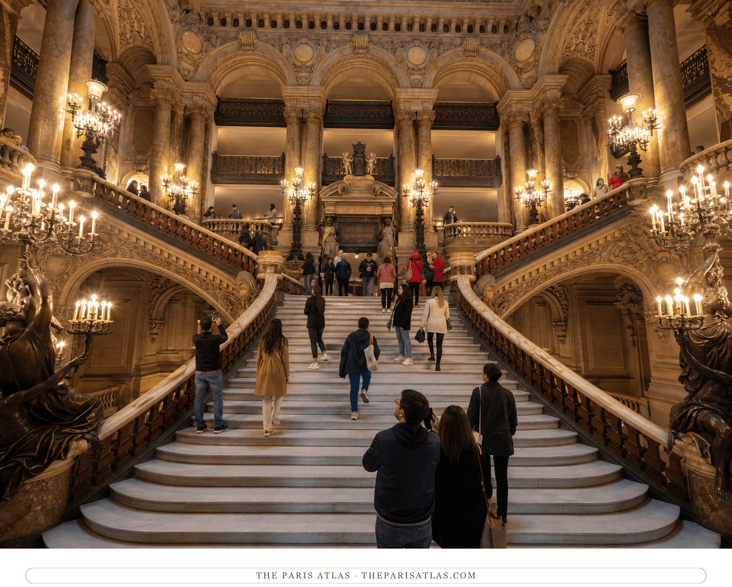 Present-day visitors ascending the marble Grand Staircase inside the Palais Garnier