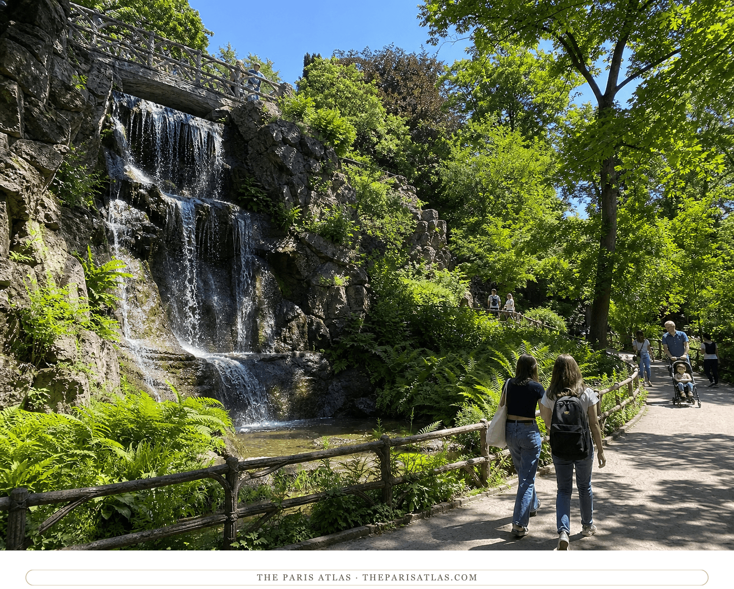 Present-day visitors walking beside the waterfall and shaded ravine in Parc Montsouris