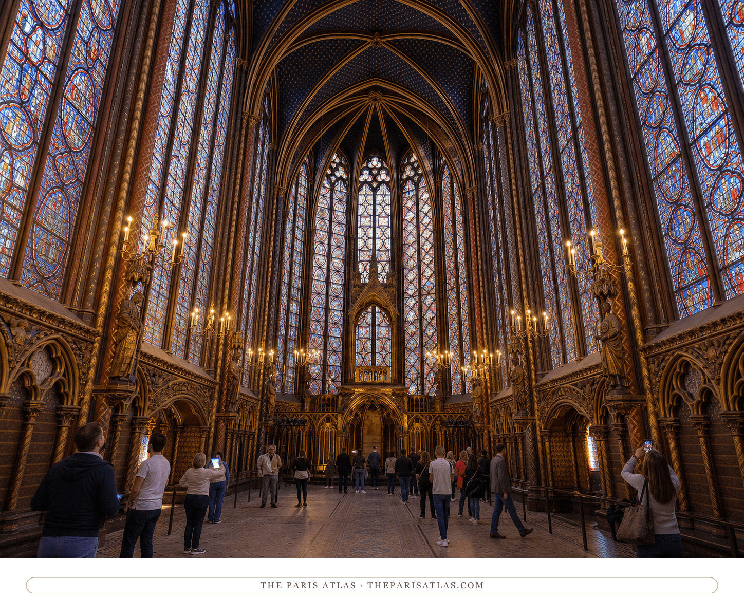 Present-day visitors beneath the stained-glass windows and star-painted vault of the upper Sainte-Chapelle