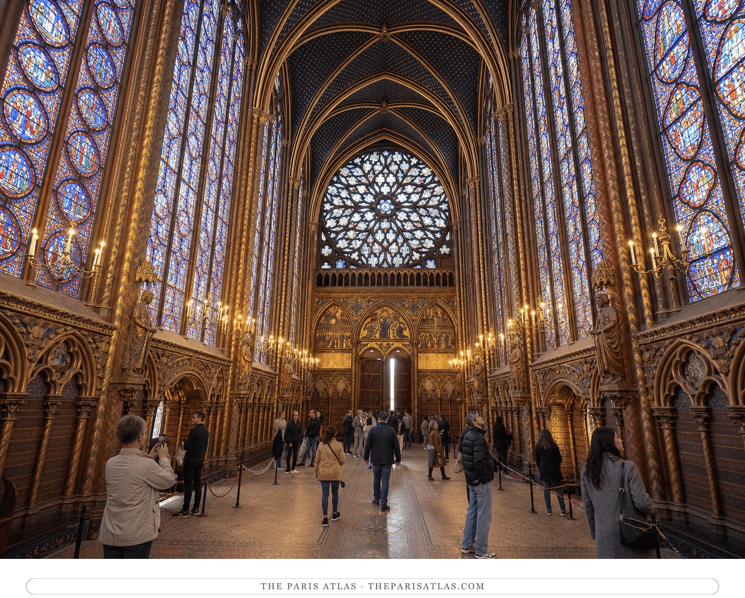 Present-day visitors looking toward the great western rose window inside Sainte-Chapelle