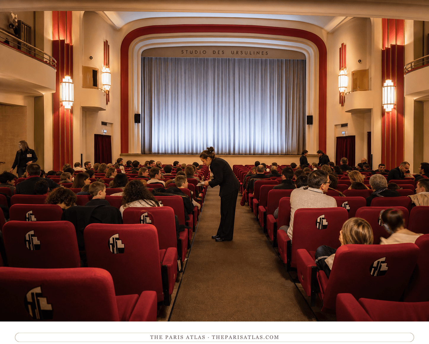 Families settling into the red Art Deco auditorium at Studio des Ursulines