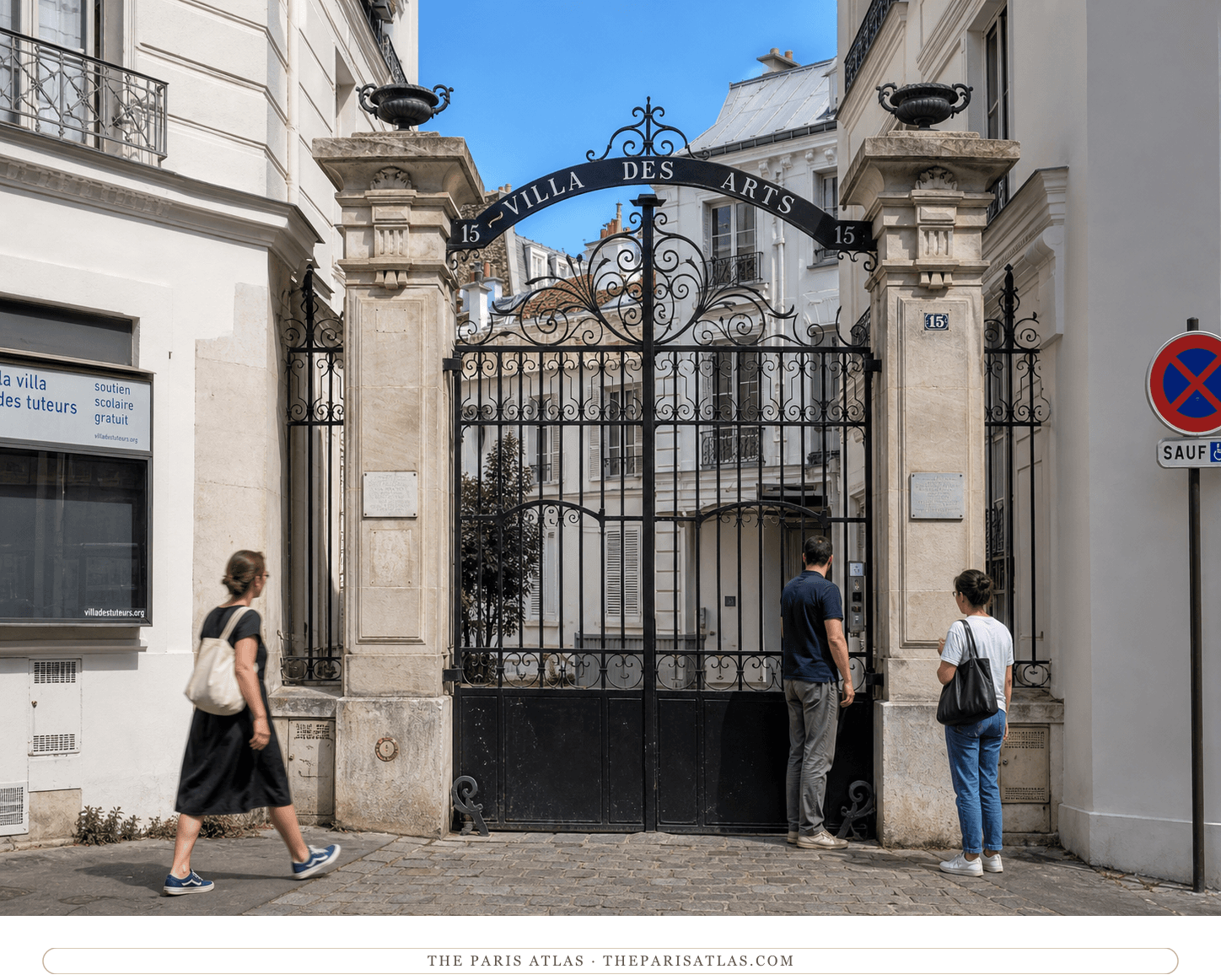 Close present-day view of the Villa des Arts wrought-iron arch and stone gateposts
