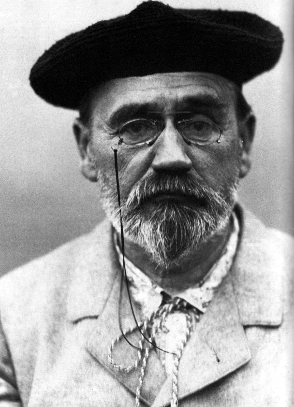 Émile Zola photographed in 1902, bearded and wearing spectacles