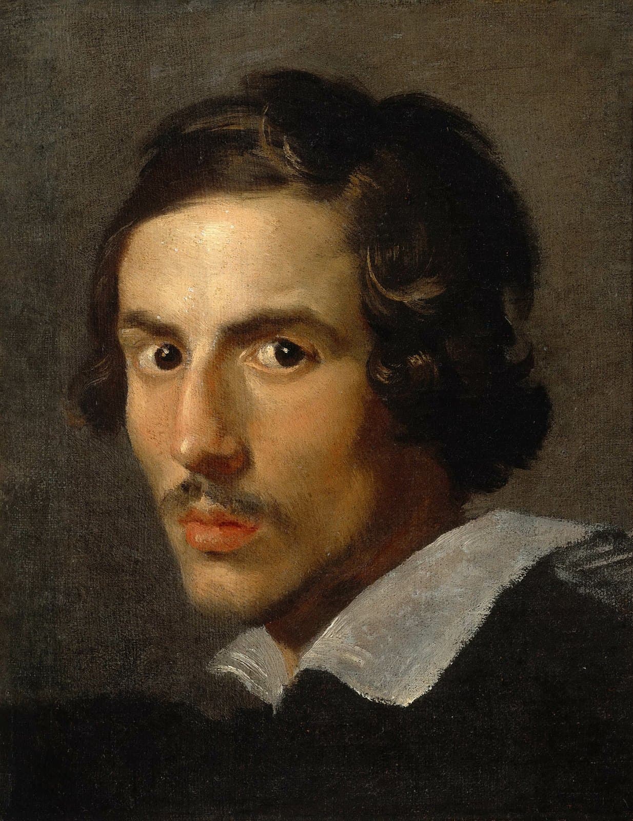 Head-and-shoulders oil portrait of a young man with dark curling hair to the jaw, a thin mustache and wide dark eyes looking straight out, wearing a black doublet with a broad white collar against a plain gray-brown ground