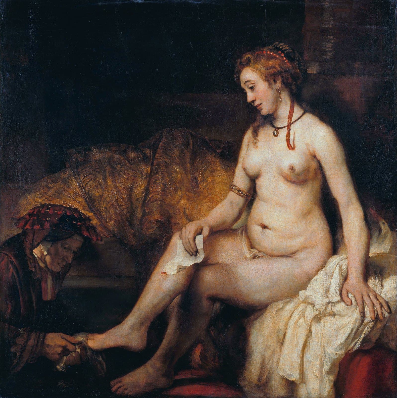A naked woman sits on white drapery, her head bowed, holding a letter on her knee. She wears red beads in her hair, a pendant on a dark cord and a gold bracelet. At the lower left an old woman in dark red dries the woman's foot with a cloth. A gold brocade cloth is heaped behind her and the rest of the picture is dark.