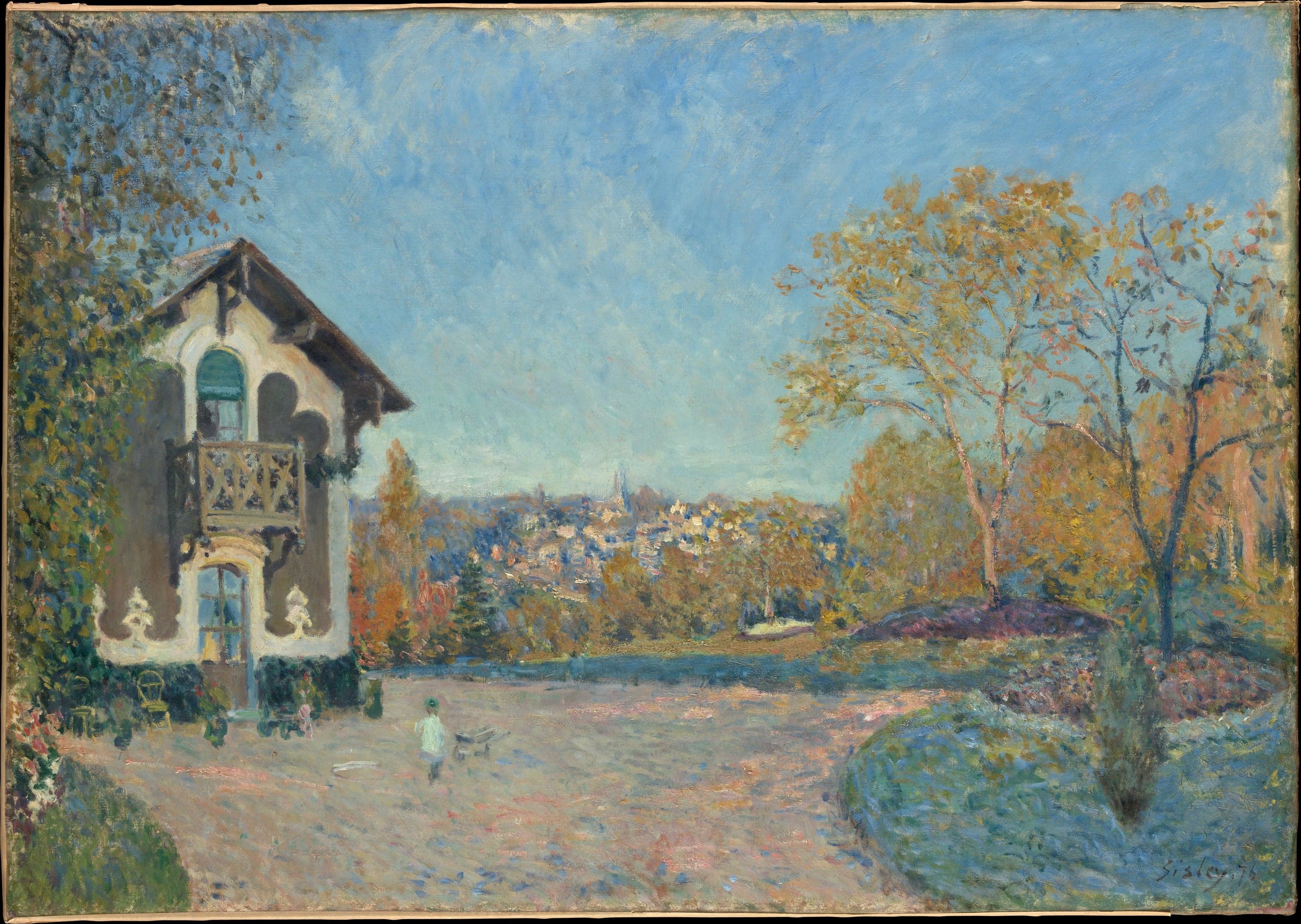 Sisley's View of Marly-le-Roi from Coeur-Volant: a chalet-style house with a wooden balcony at the left, a group of slender trees in orange and gold autumn foliage at the right, a wide stretch of bare pink and lavender ground between them with a small child in a green hat beside a wheelbarrow, and a village with a church spire on the hillside beyond
