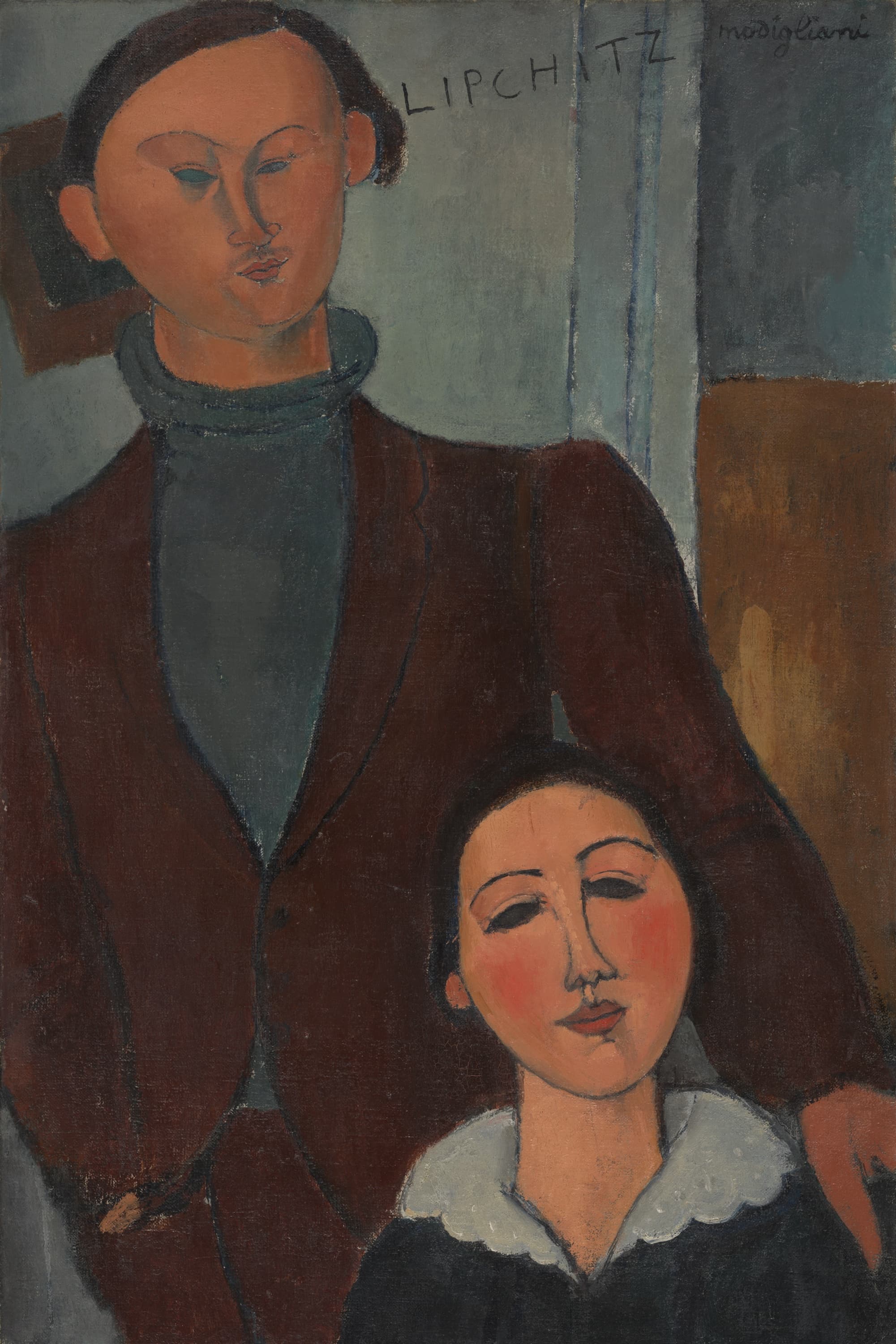 A double portrait. A man with dark hair and pale blank eyes stands behind a seated woman, wearing a red-brown jacket over a gray-green turtleneck. His name, LIPCHITZ, is lettered across the gray-green wall beside his ear. The woman, lower down at the right, has black hair, dark lowered eyes, pink cheeks and a wide white scalloped collar over a dark dress. His hand shows at the right edge beside her collar. A dark square hangs behind his head and a brown panel stands at the right. Signed modigliani at upper right