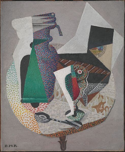 A Cubist café still life. A tall emerald green bottle stands left of centre against a field speckled red and blue, with a stemmed glass to its right whose dotted bowl holds a wedge of red. A spoon with a pierced black bowl lies flat below them. At the upper right a dark plane tips back off an open box of brown cigars, and a round paper label on the box holds a small painted landscape of a red-roofed building, trees and a yellow field, with capitals reading BENITO JUA round its rim. The table is described by dots alone, shifting from pale green through yellow to orange, and a flared cast-iron foot shows on the grey ground beneath