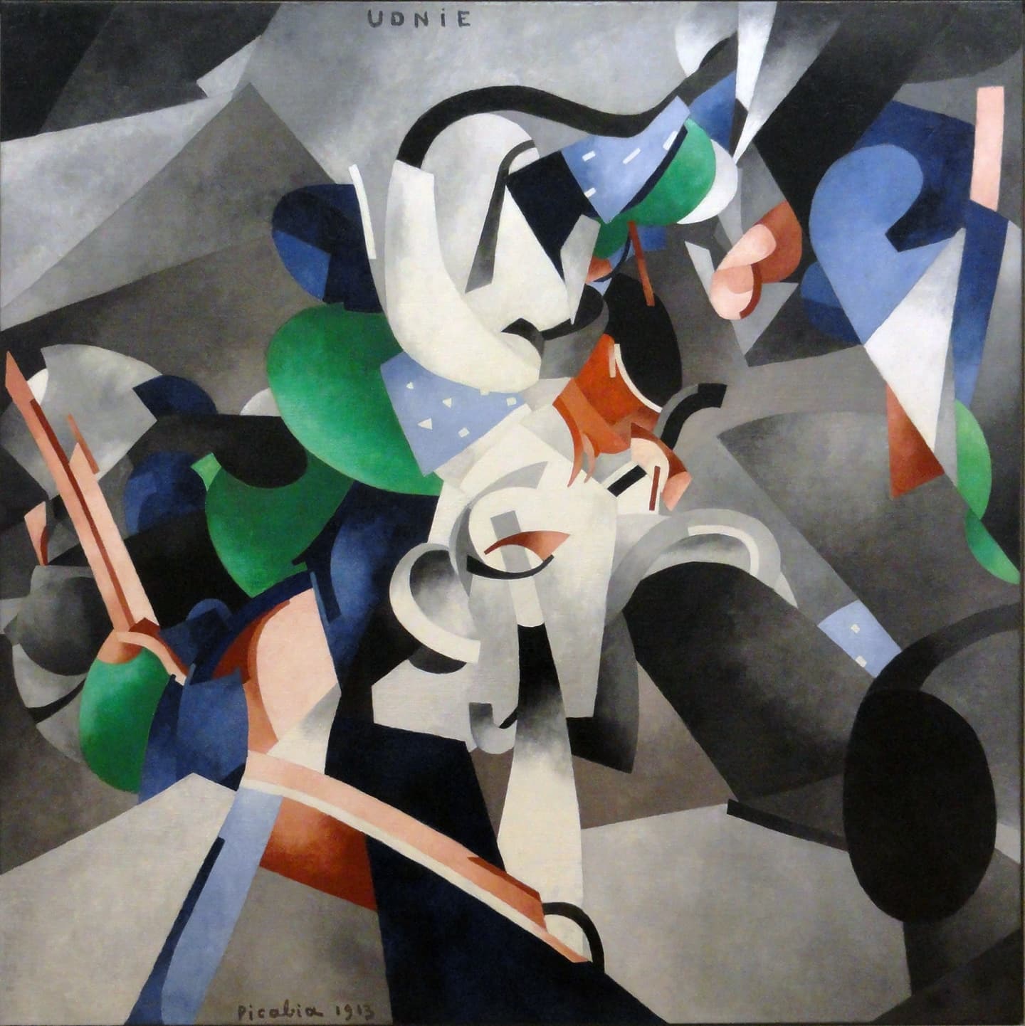 A nearly square canvas crowded with flat, hard-edged shapes that swirl out from the centre: white curls and bands shaded like polished metal, bright green fans, dark and pale blue plates, pale blue pieces dotted with small white marks, rust-orange and pink bars, and a large black oval at the lower right, all against grey planes that shade from light to dark. The word UDNIE is written at the top and Picabia 1913 at the bottom