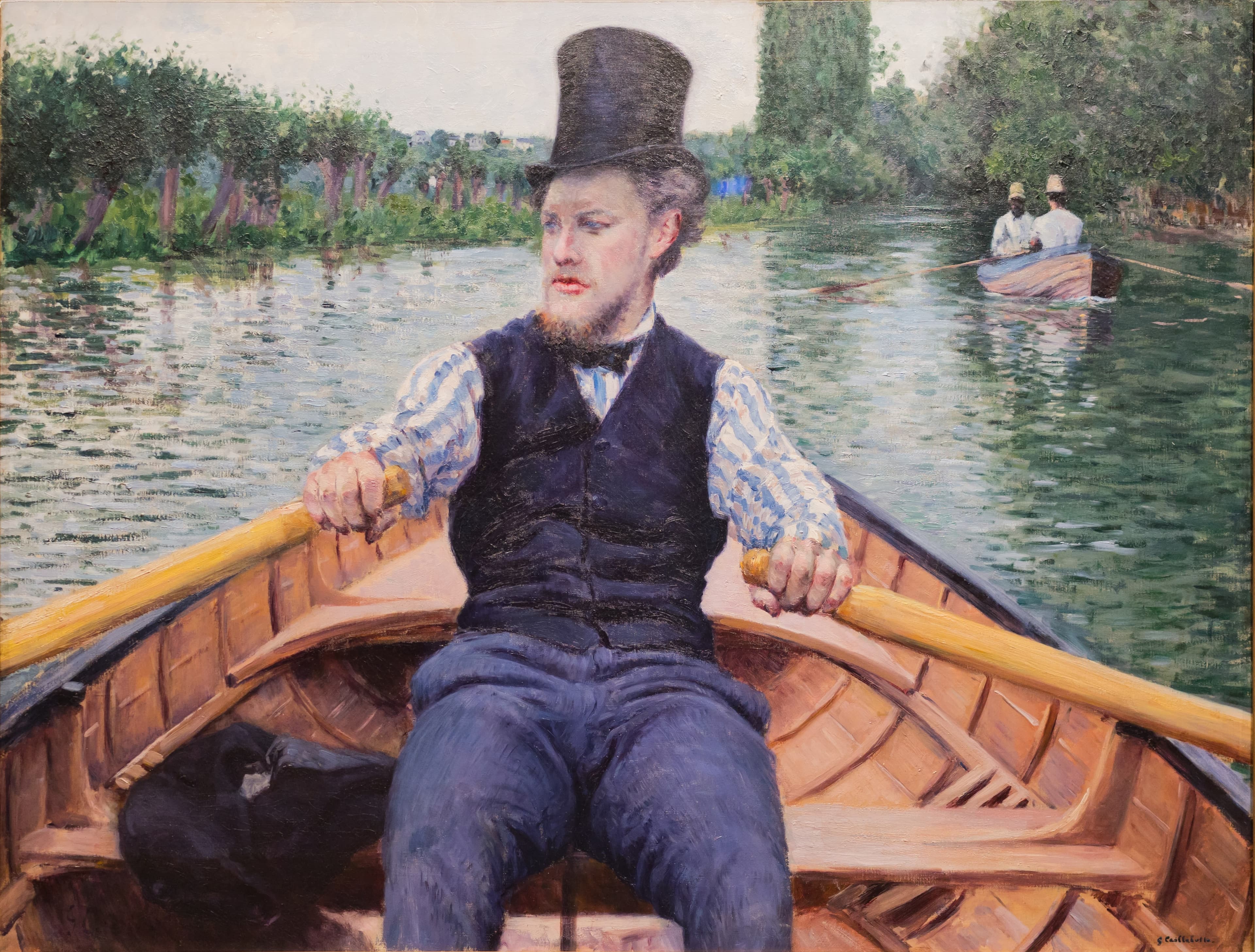 Caillebotte's Boating Party: a man in a black top hat, white shirt and waistcoat rows a wooden skiff directly toward the viewer on the green river Yerres, oars mid-pull, the tree-lined banks closing a high horizon