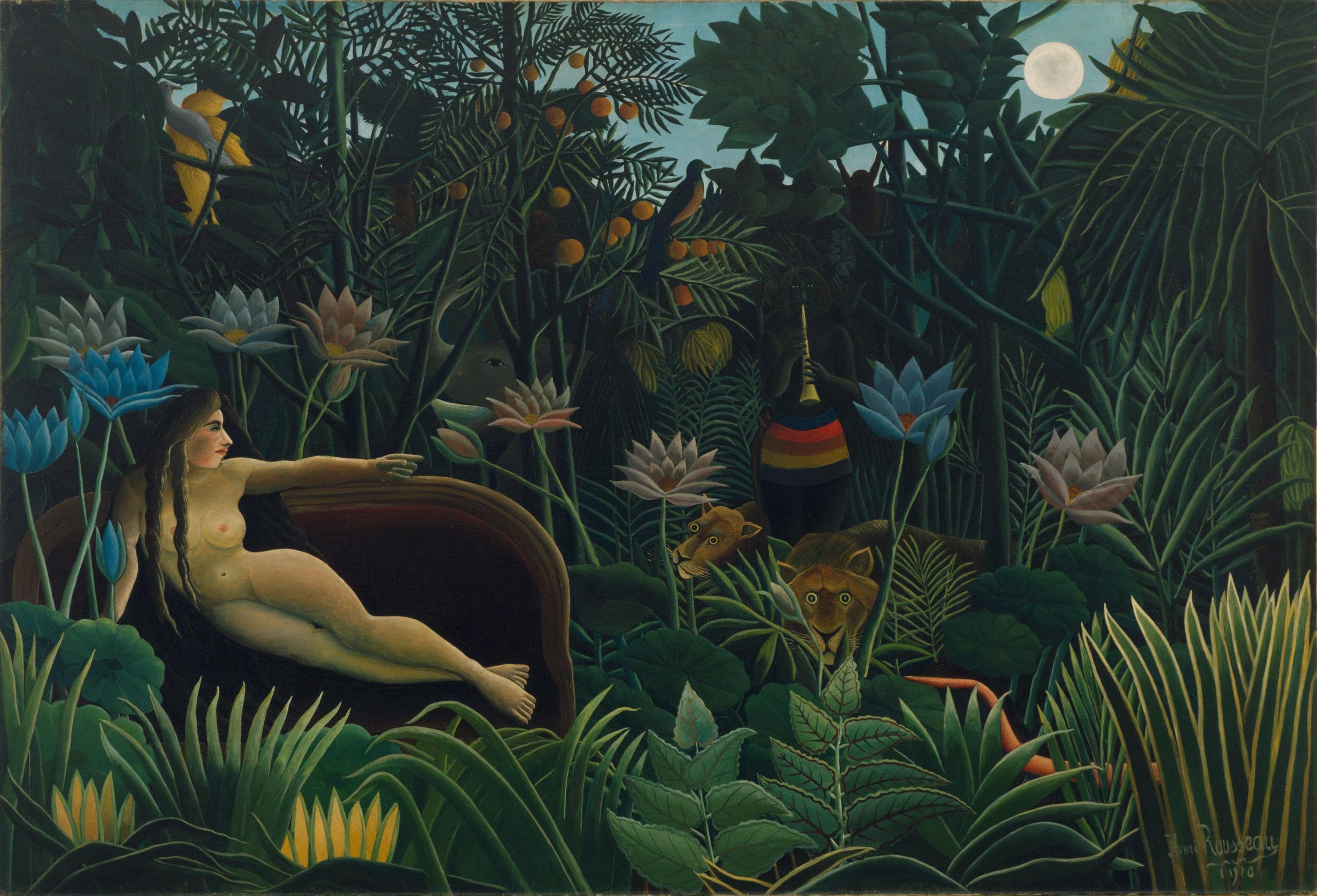 A naked woman with long dark hair reclines on a dark red sofa at the left of a moonlit jungle, one arm stretched out toward a dark figure in a striped wrap playing a pipe, with a lion and lioness, an elephant, birds and huge pink and blue lotus flowers among the leaves