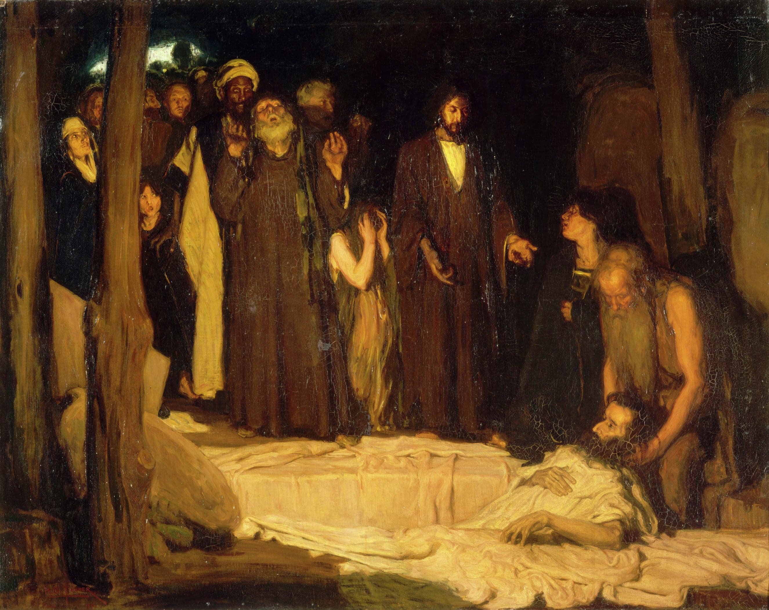 A dark tomb interior. Lazarus lies at the lower right on a stone slab in a white shroud, his head raised and eyes open, while a bald old man in a sleeveless tunic bends over him and lifts his head. Christ stands right of centre in a dark brown robe with a white collar, looking down and pointing at Lazarus with his right hand; a dark-haired young figure below the hand looks up at him. A crowd fills the left half: a man in a yellow turban, an old man with his head thrown back, a woman in a white headcloth behind a tree trunk with a child's face below her, and a girl in a pale dress with her hands to her face. Two rough tree trunks cut across the left, a flat stone leans at the lower left, and a patch of pale night sky shows at the upper left