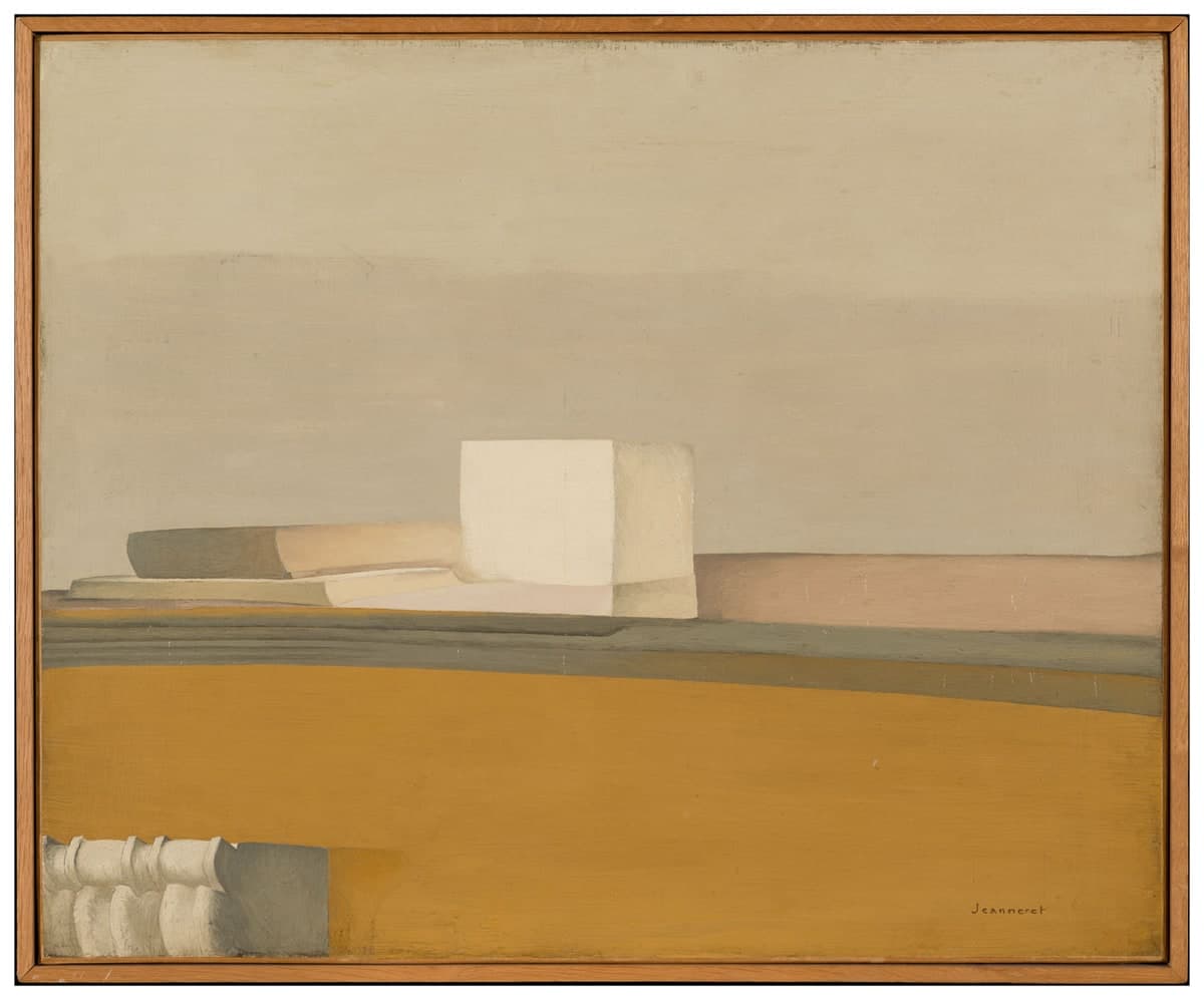 A painting in a plain pale wooden frame. A white cube stands a little left of centre on a mantelshelf, its front face flat, its right side in warm grey. To its left a low stack of a grey-green block and a buff wedge; to its right a band of dusty pink running to the edge, with a narrow grey-green line beneath it. The wall above is one field of putty grey, the area below the shelf one flat ochre. Four small white turned forms stand against a grey rectangle in the bottom left corner, and the signature Jeanneret is written small at the lower right