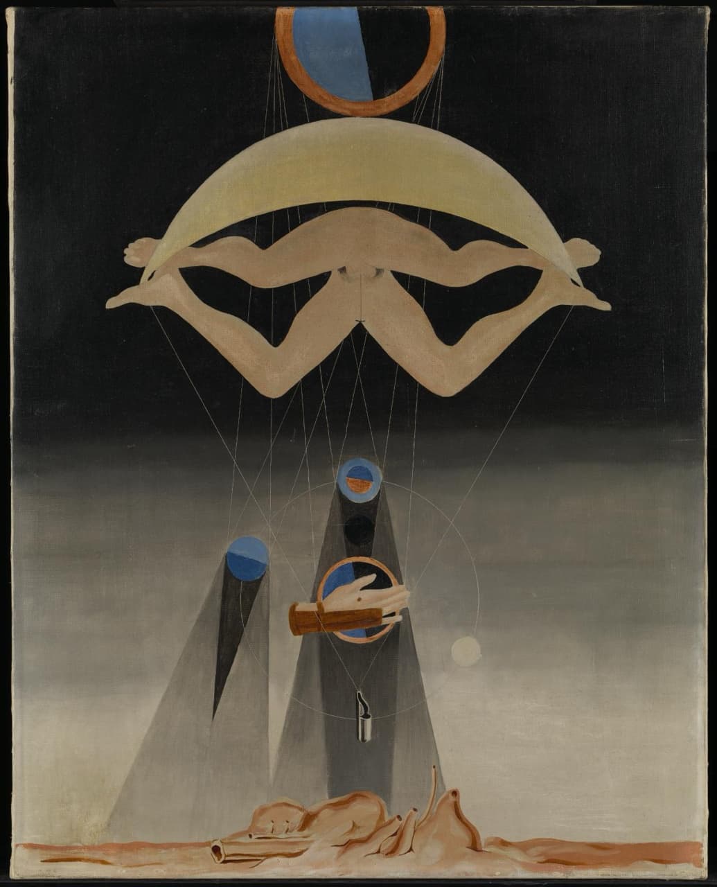 A copper ring half filled with blue hangs at the top of a black sky above a wide pale yellow crescent. Under the crescent float the joined lower halves of a naked man and woman, legs bent out like a W. Fine threads run down to two grey cones topped with discs, a gloved hand over a half-blue ring, a small pale moon and a little hanging silver tube. At the bottom lies a heap of pinkish flesh-like shapes on a reddish plain