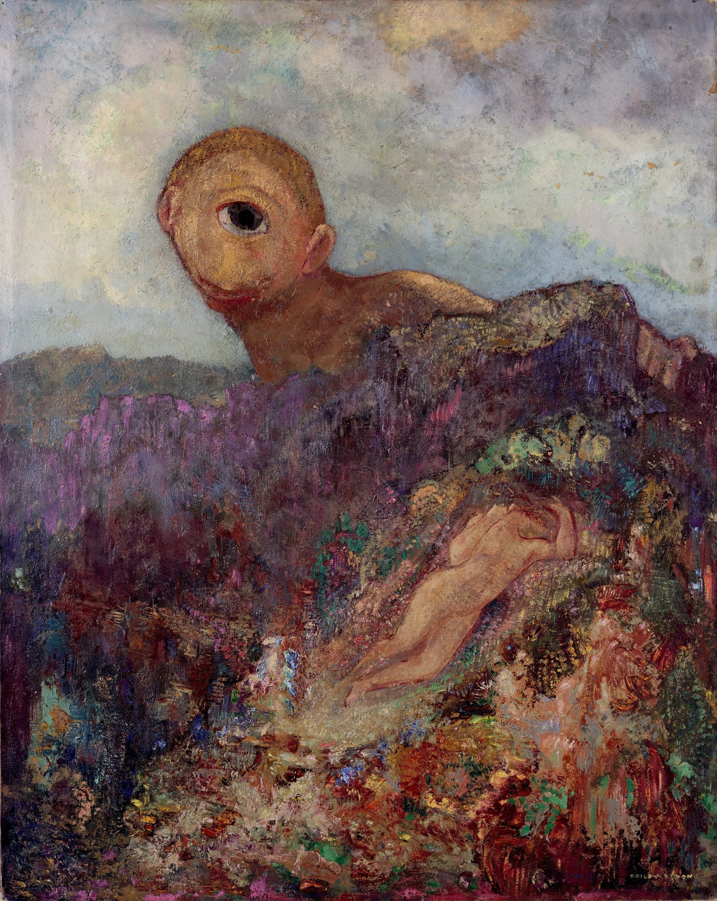 A bald pale-gold head with one huge dark eye rises over a purple mountain ridge; below it a naked woman lies asleep across a slope of violet, green and crimson flowers, her arm folded above her head