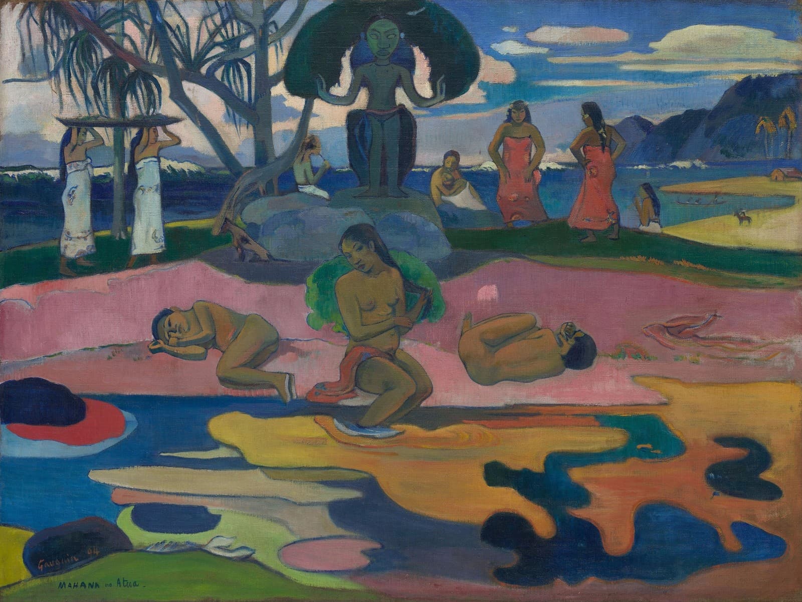 Gauguin's Mahana no atua: a carved idol with raised arms presides over a beach where women carry offerings and dancers cross the sand, while bathers sit at a foreground pool whose surface breaks into flat shapes of pink, yellow, and violet