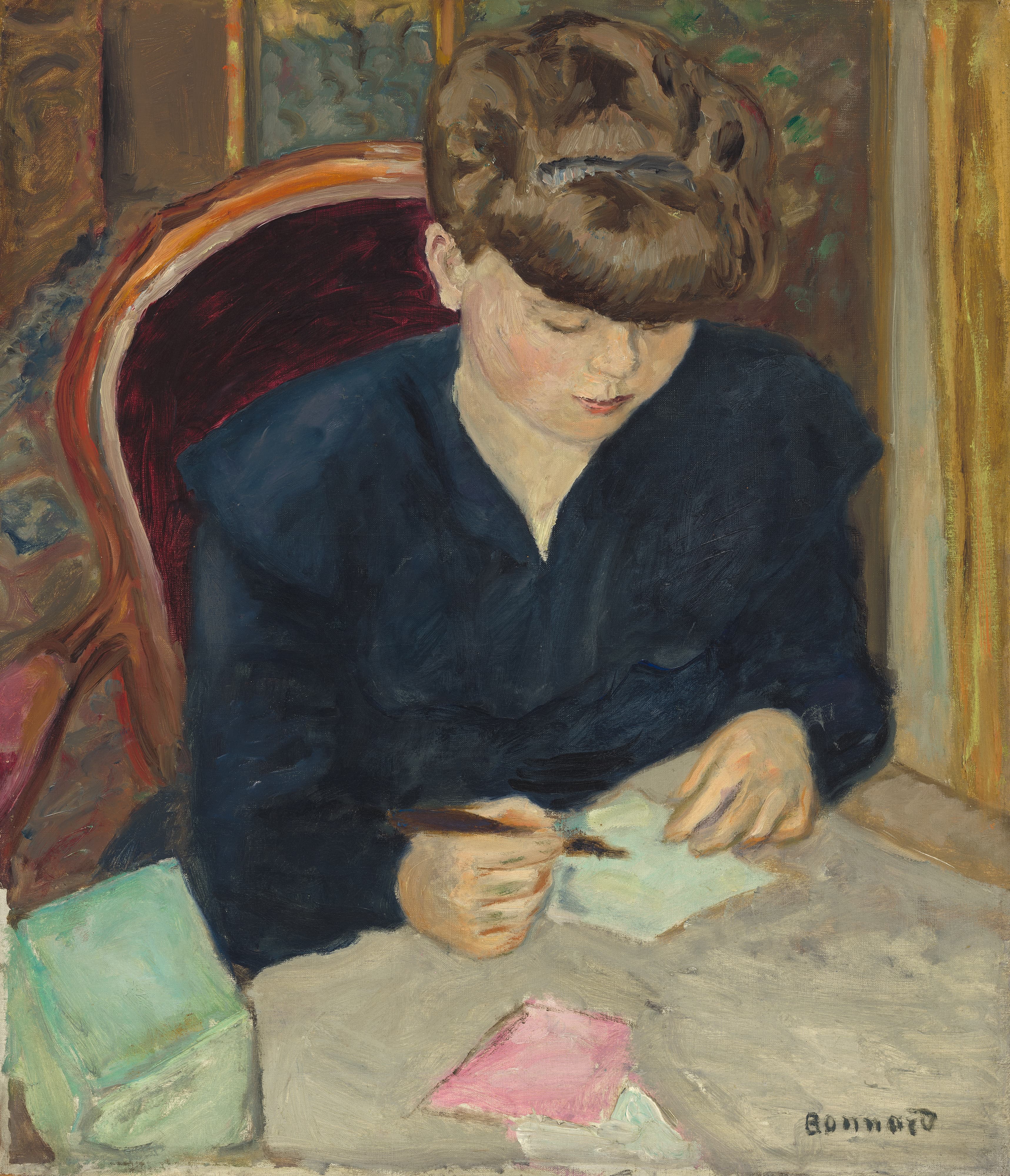 Bonnard's The Letter: a young woman in a dark blue dress bends over a pale blue-green sheet of paper on a warm grey table, a pen in her right hand and her left hand flat on the page, with piled brown hair, a crimson chair back behind her and a mint-green book at the lower left