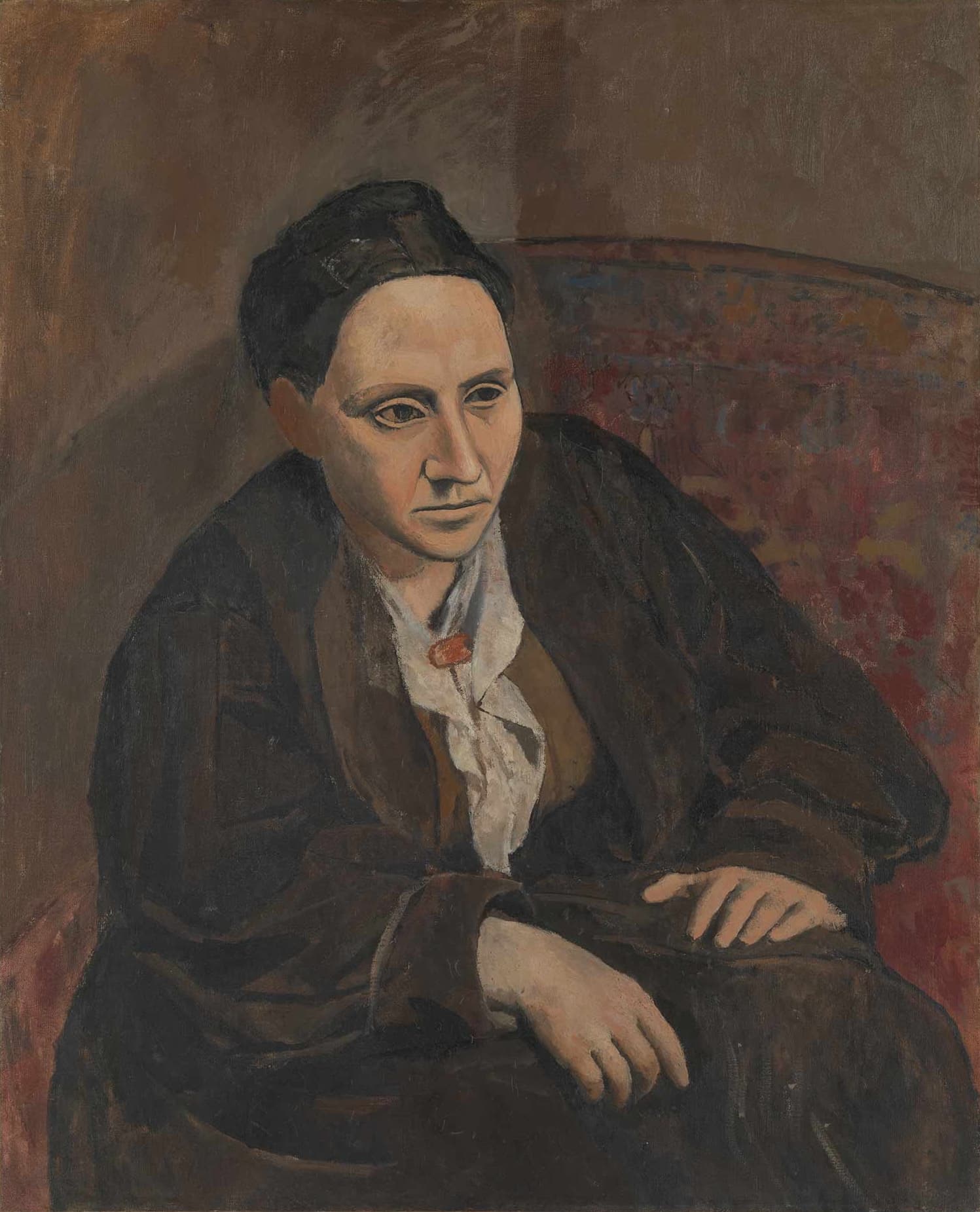 Picasso's portrait of Gertrude Stein, seated in three-quarter view in a brown robe, her face rendered in the mask-like planes he repainted from memory