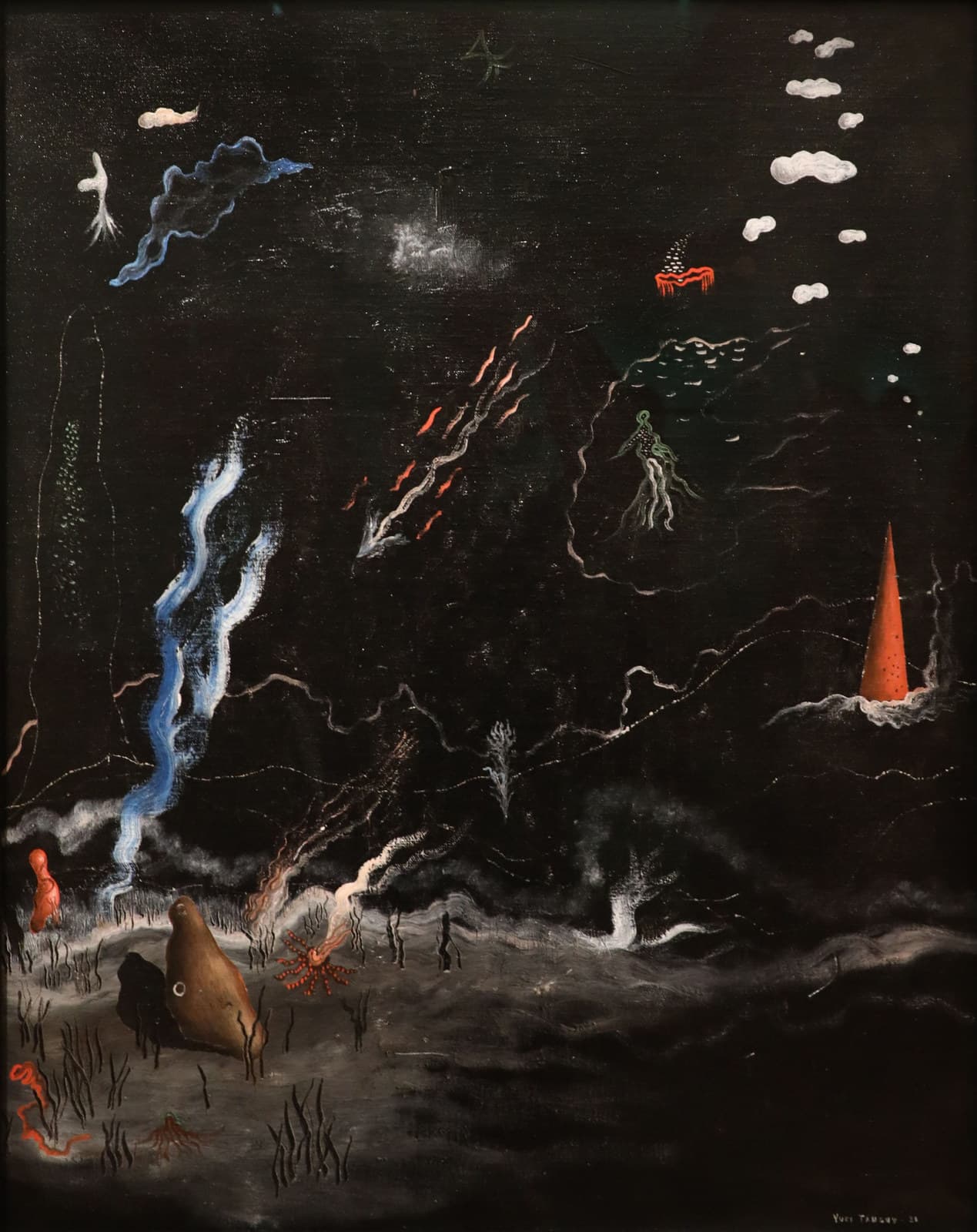 A near-black painting with a pale grey churning ground along the bottom. A bright vermilion cone stands at the right with white spray at its foot. A brown boulder with a white ring set into it rests at the lower left beside a red starfish shape with beaded arms. A blue ribbon curls at the upper left beside a small white plume, a row of white cloud-blobs steps down the right edge, and a run of red-orange darts crosses the middle diagonally