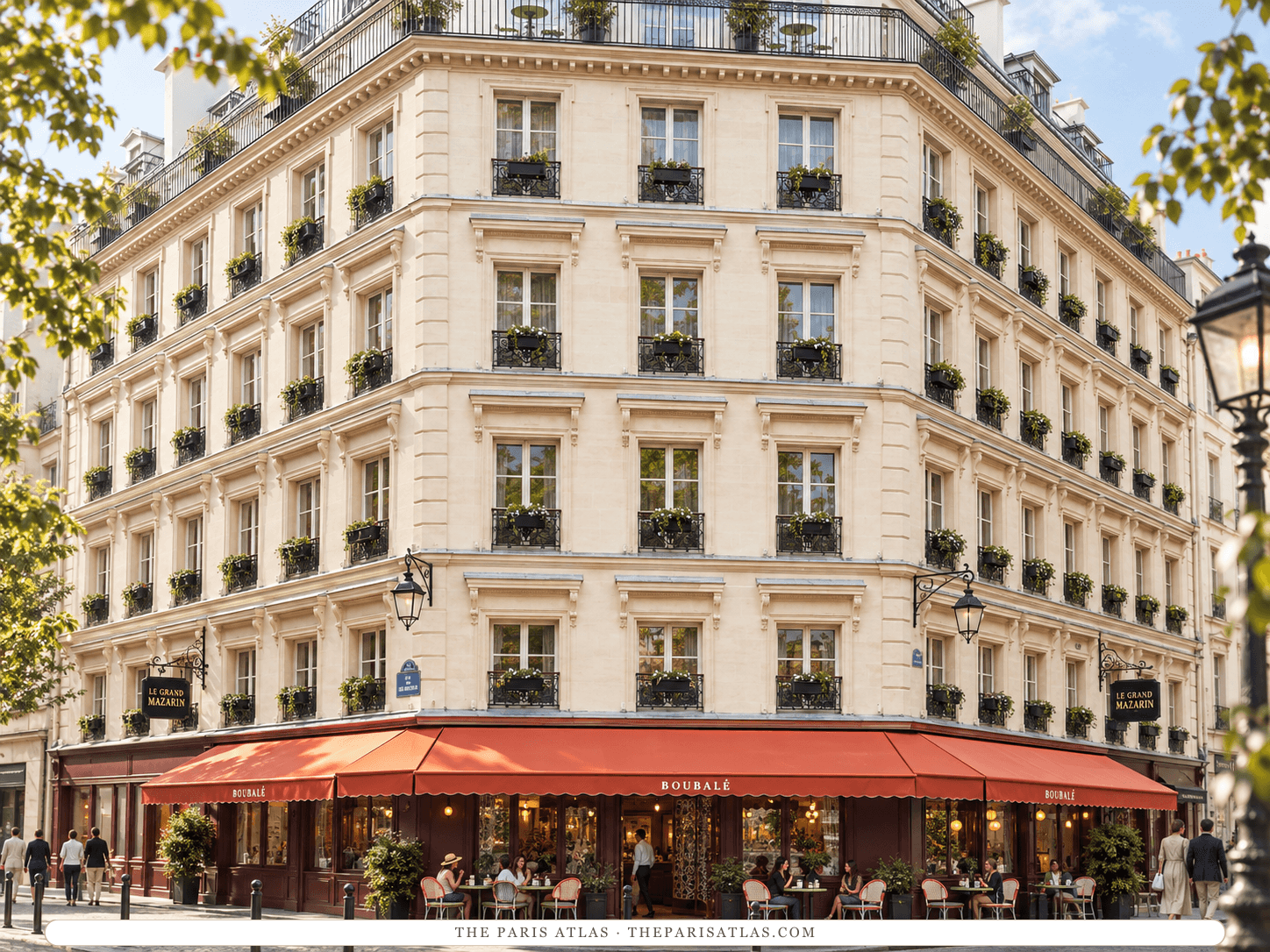 Reference-based illustration of Le Grand Mazarin: a cream stone corner building of six storeys with iron balconies and window boxes, and a long red awning over the Boubalé restaurant terrace at street level.