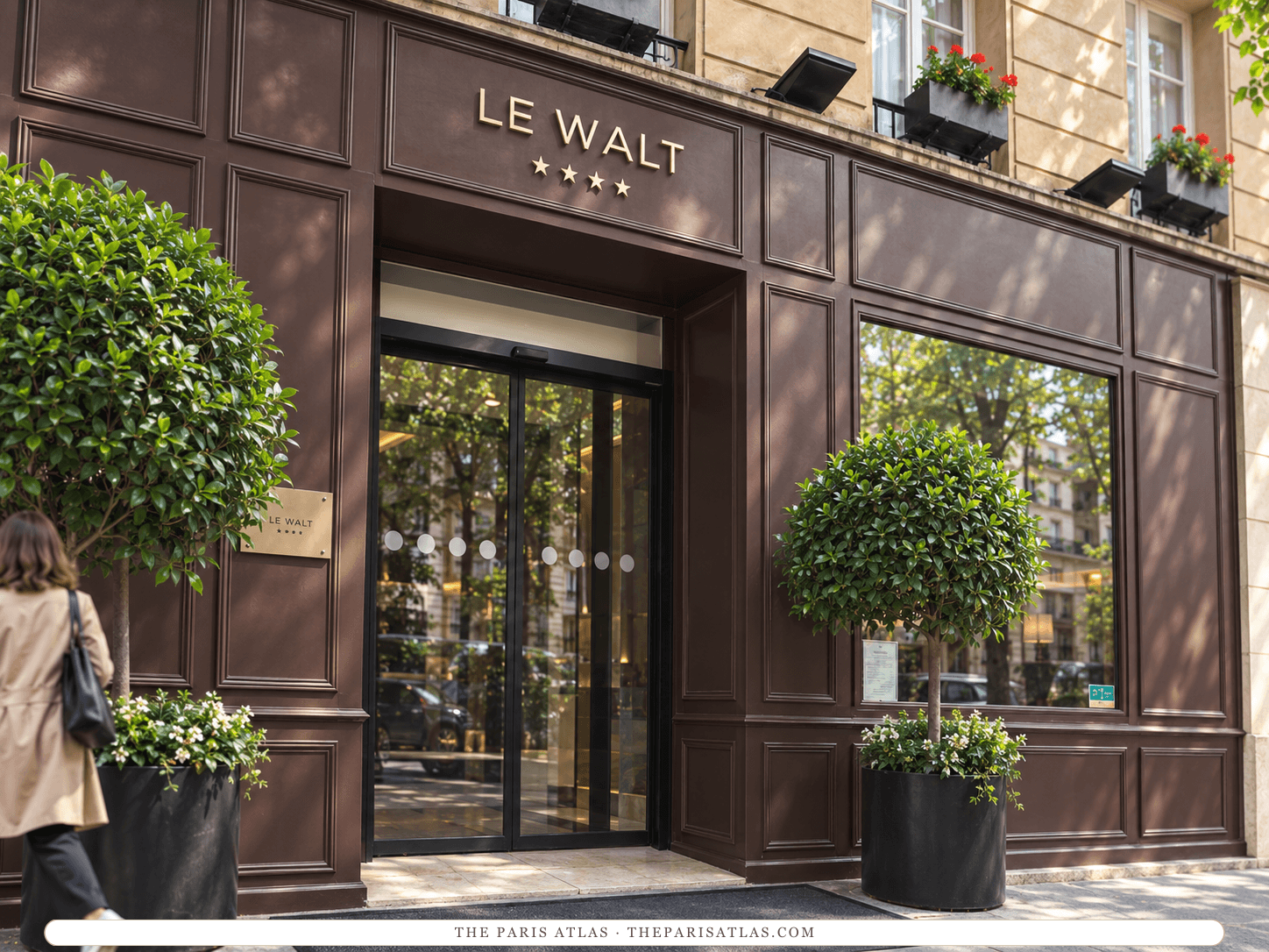 Illustration of Hôtel Le Walt’s brown-paneled entrance, gold sign and clipped trees.