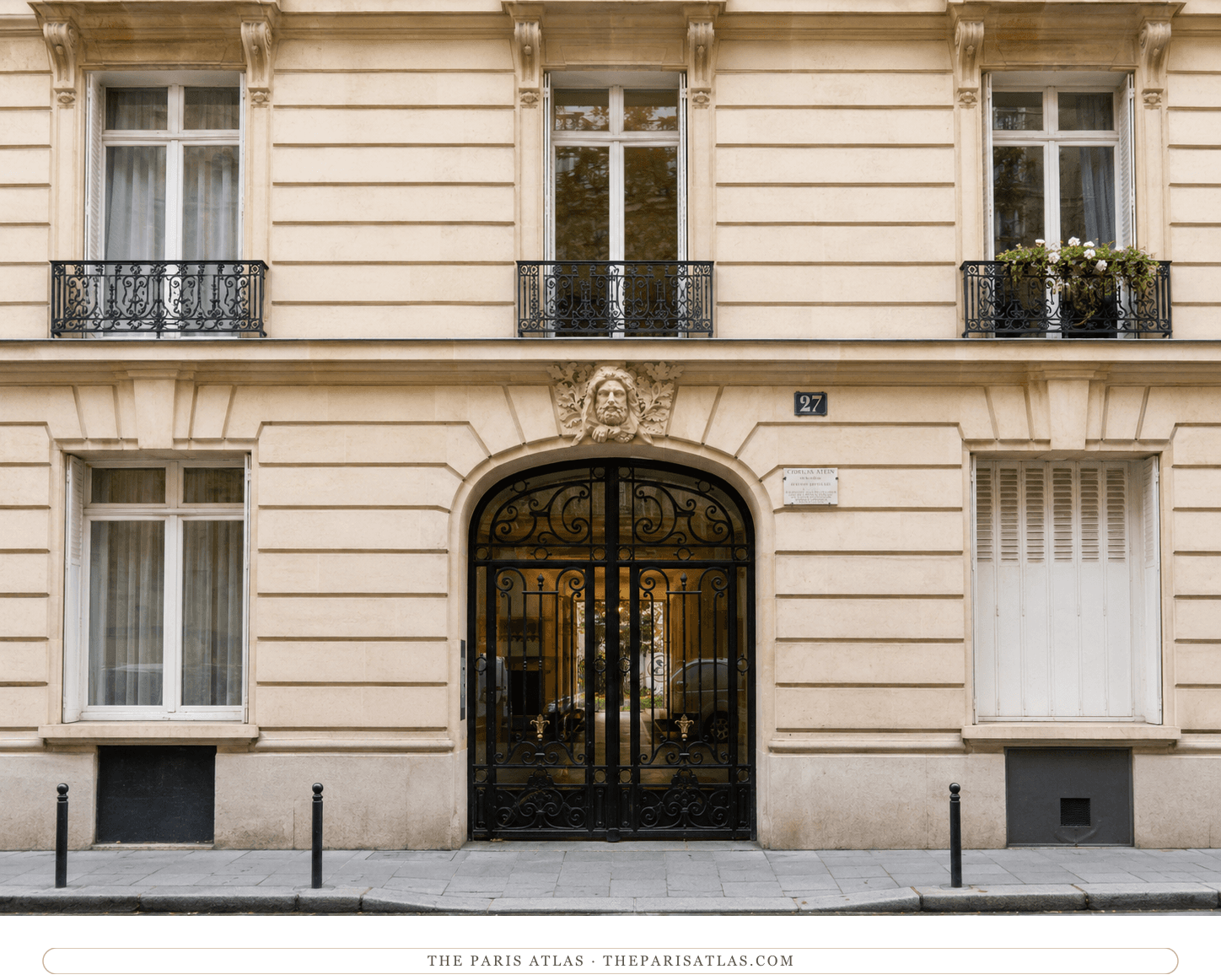 The entrance of 27 rue de Fleurus today, cream stone façade and black ironwork gate