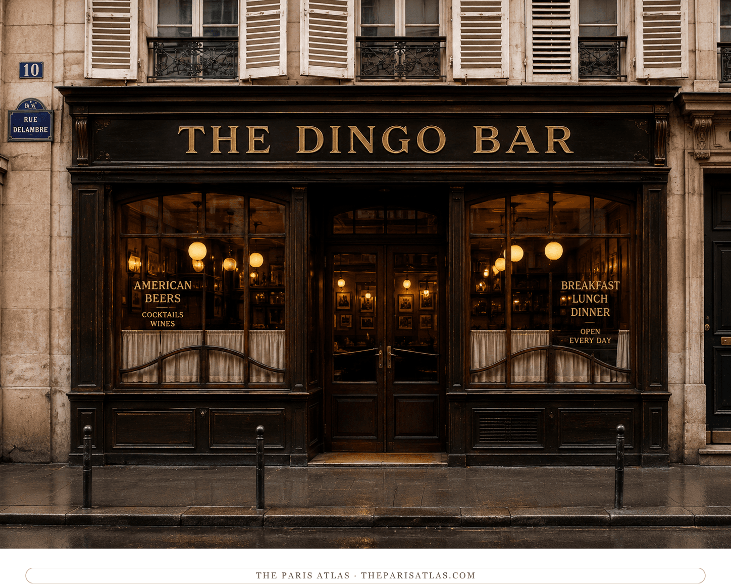The Dingo Bar's dark wooden façade at dusk, lamps lit behind the curtained windows
