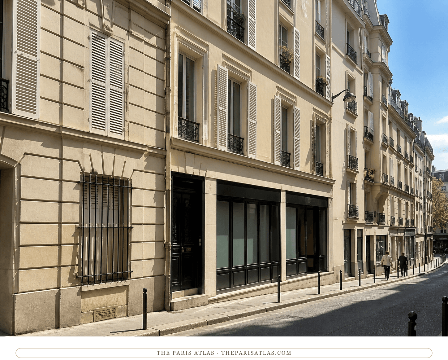 Color present-day editorial view of cream residential façades along the narrow rue Nollet