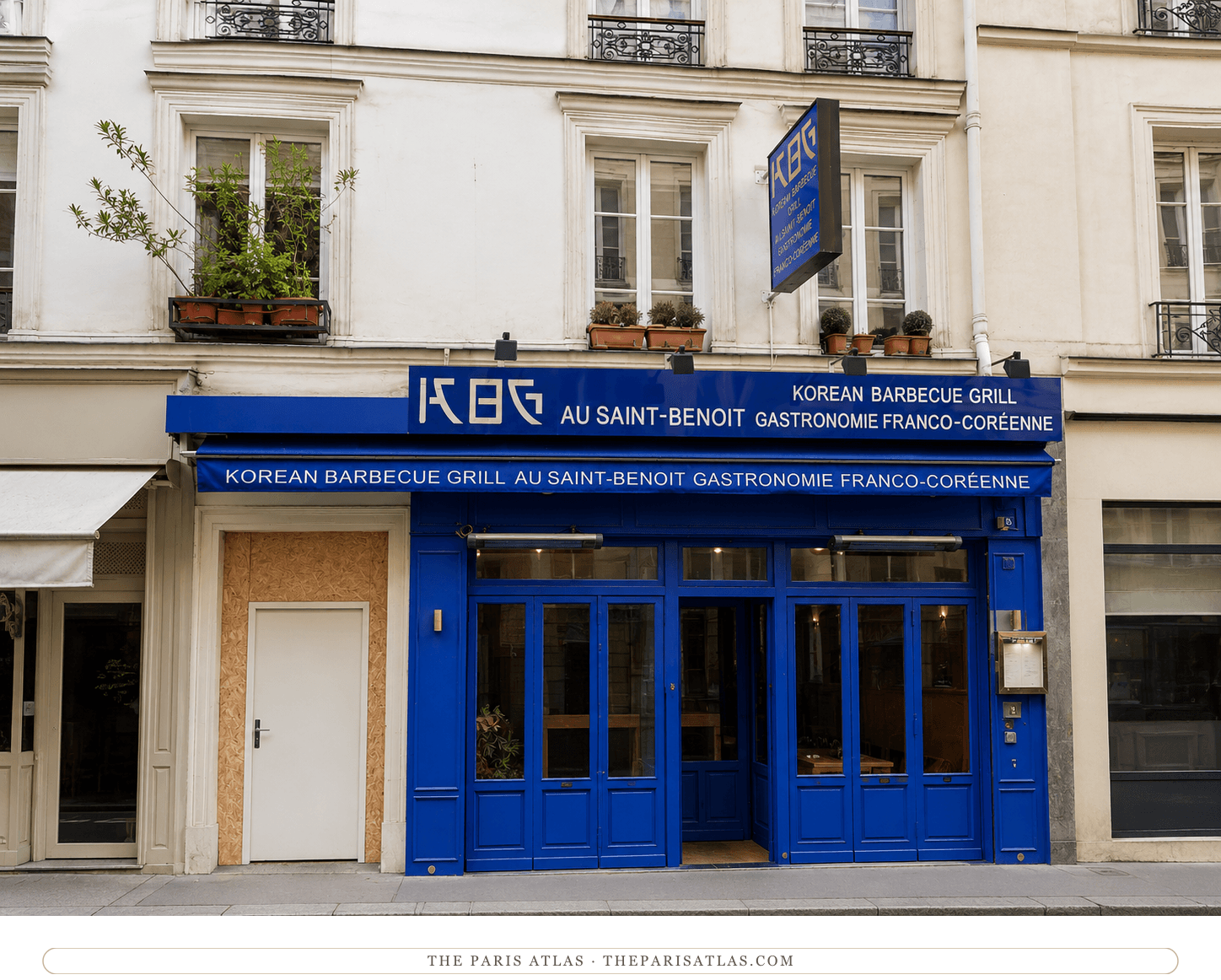 26 rue Saint-Benoît today, a cream Haussmann façade with plants at the balconies and a bright blue restaurant frontage at street level