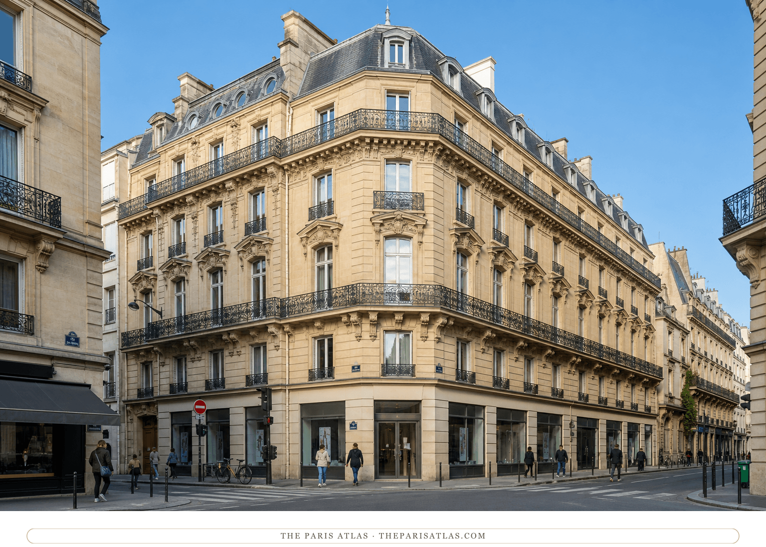 Bright color present-day view of the pale stone corner building at 28 avenue de l'Opéra