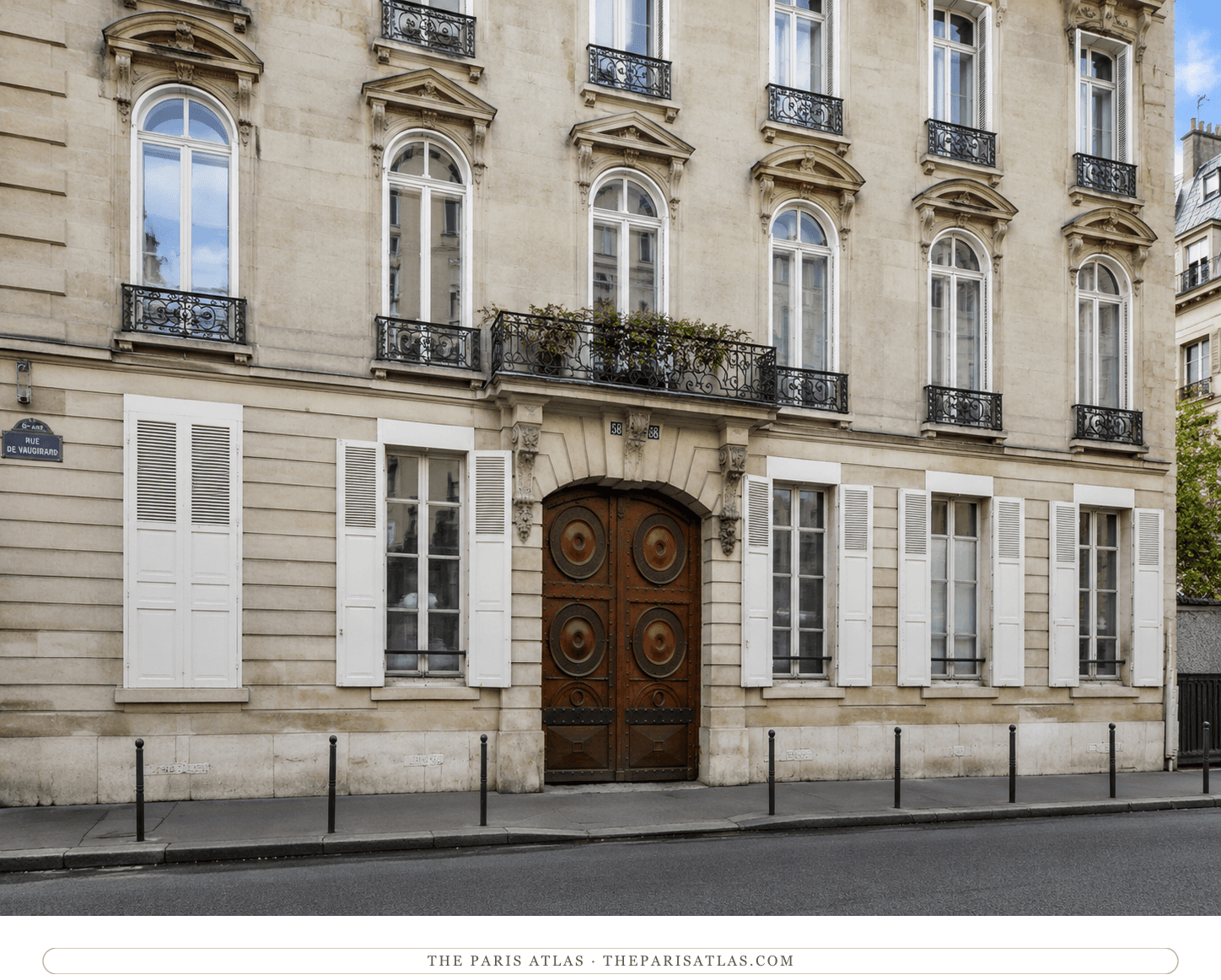 58 rue de Vaugirard today — pale stone, white shutters, and round-studded wooden carriage doors