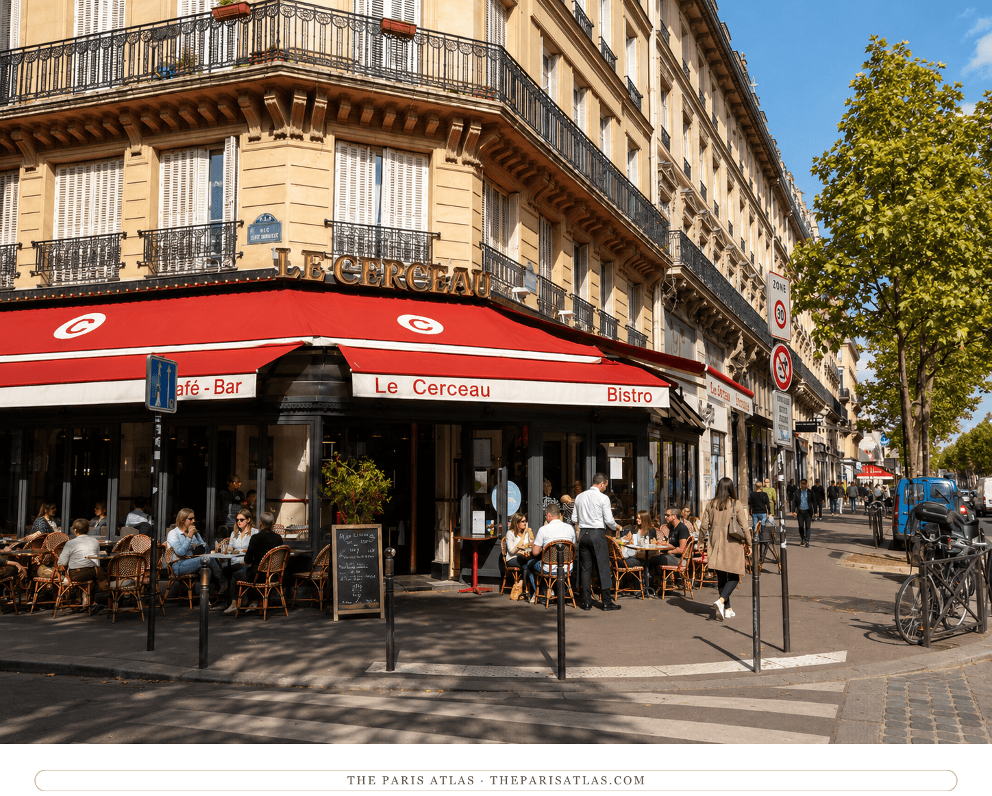 The same corner in colour, the awning red and gold, the terrace full in September sun