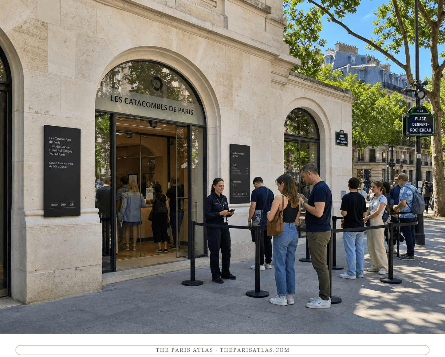 Bright present-day color view of the pale stone and glass Paris Catacombs entrance