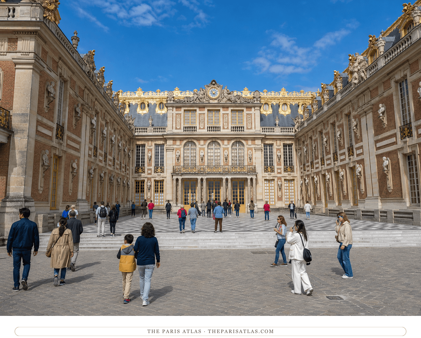 Present-day color view of the gilded Marble Courtyard at Versailles beneath a blue sky