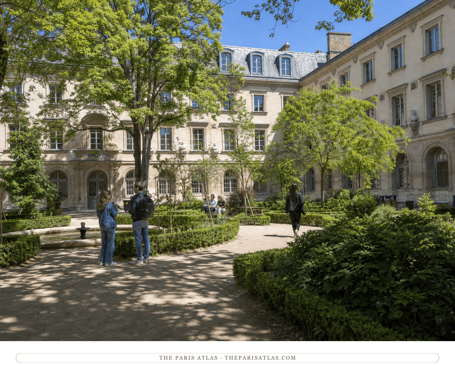 Students crossing the sunlit Cour aux Ernest at the École normale supérieure