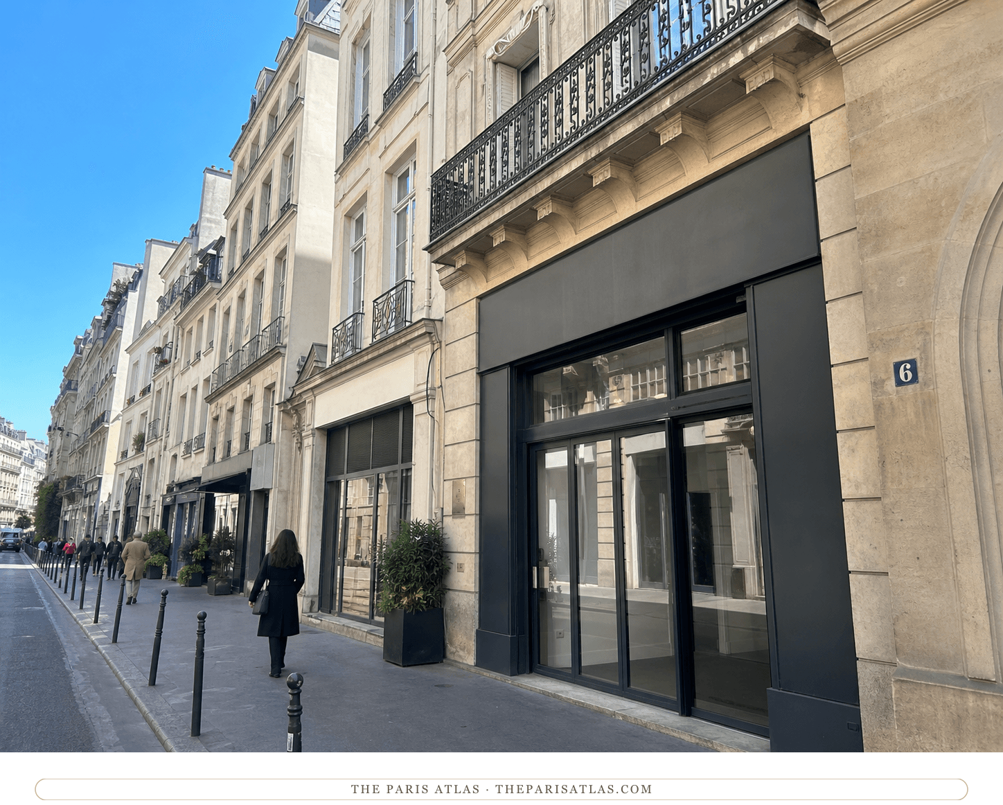 Bright present-day view of an ordinary dark storefront at number 6 rue Laffitte