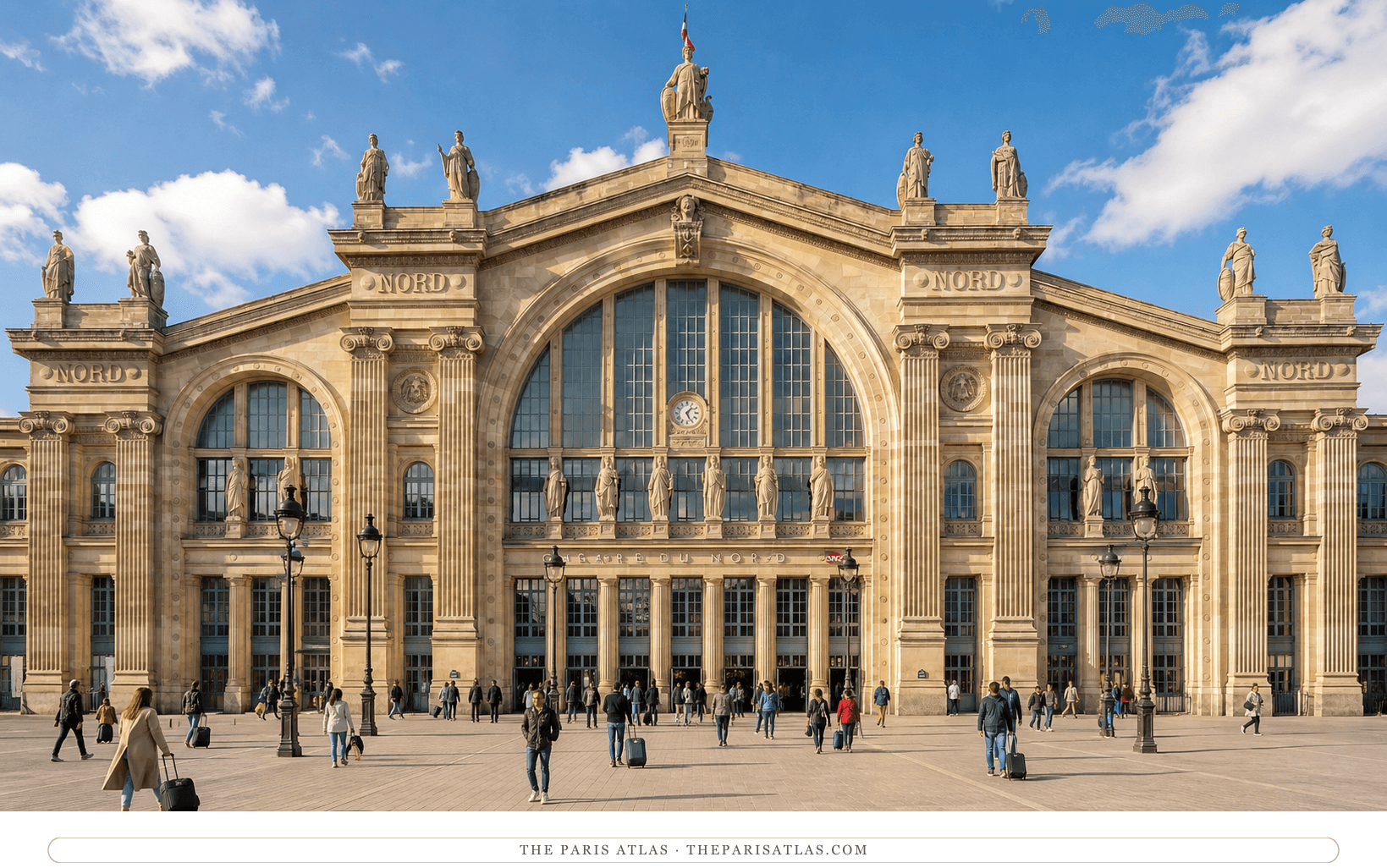 Color present-day view of the Gare du Nord façade beneath a blue sky, with travelers crossing the open forecourt
