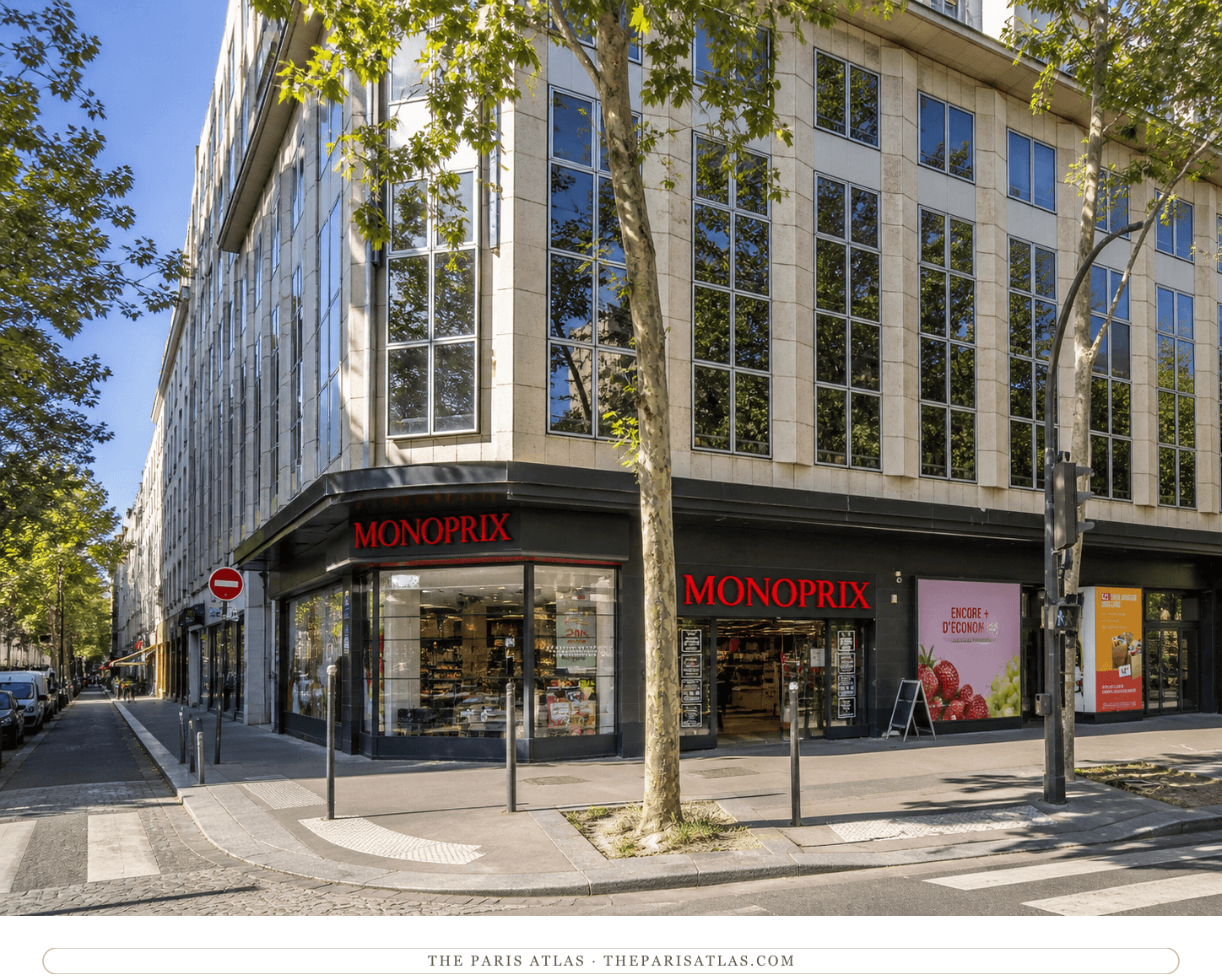 Bright present-day color view of the Monoprix corner at 43–45 avenue de Clichy
