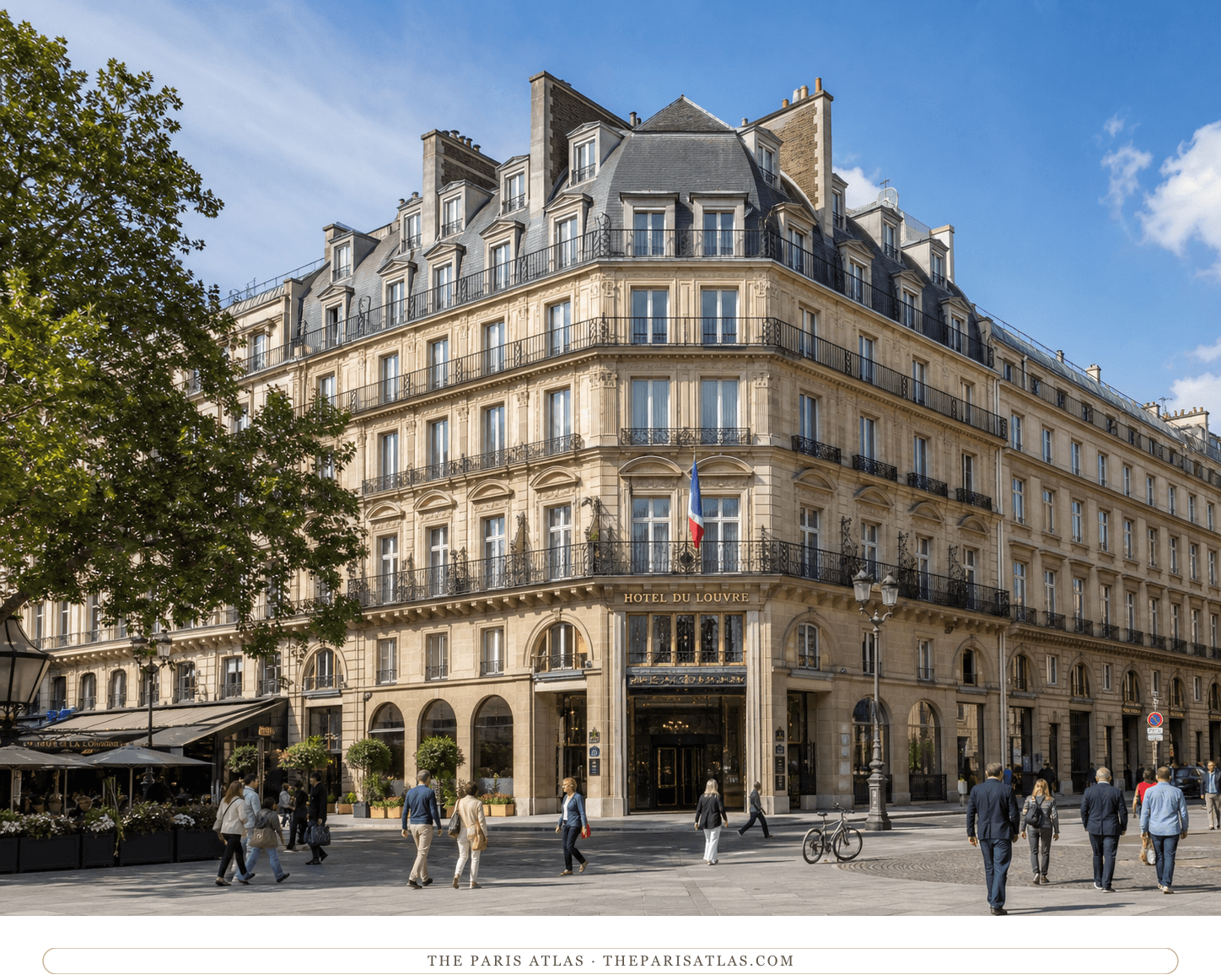 Present-day color view of the Hôtel du Louvre beneath a bright blue Paris sky