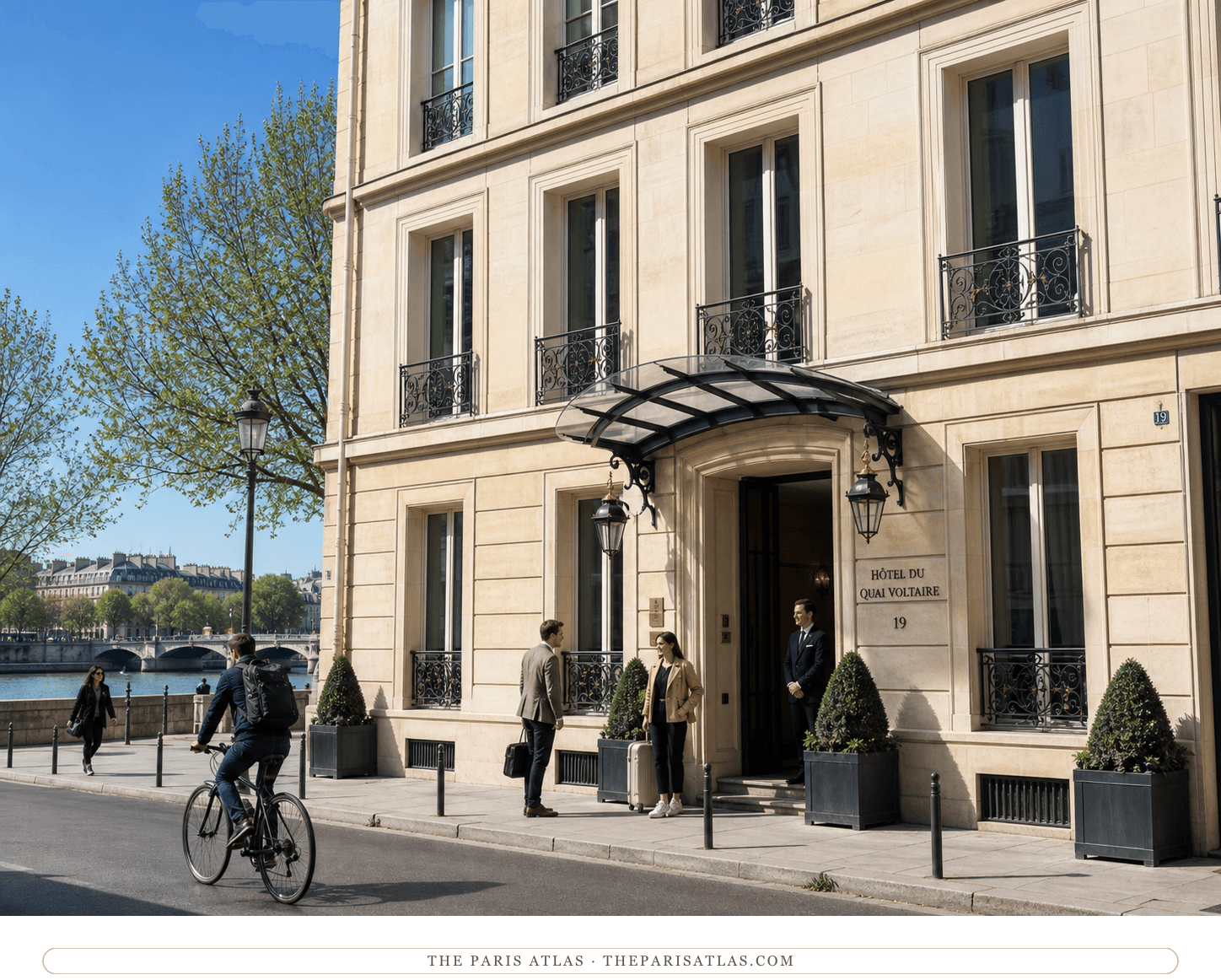 Present-day color view of the pale-stone Hôtel du Quai Voltaire beneath a bright blue sky