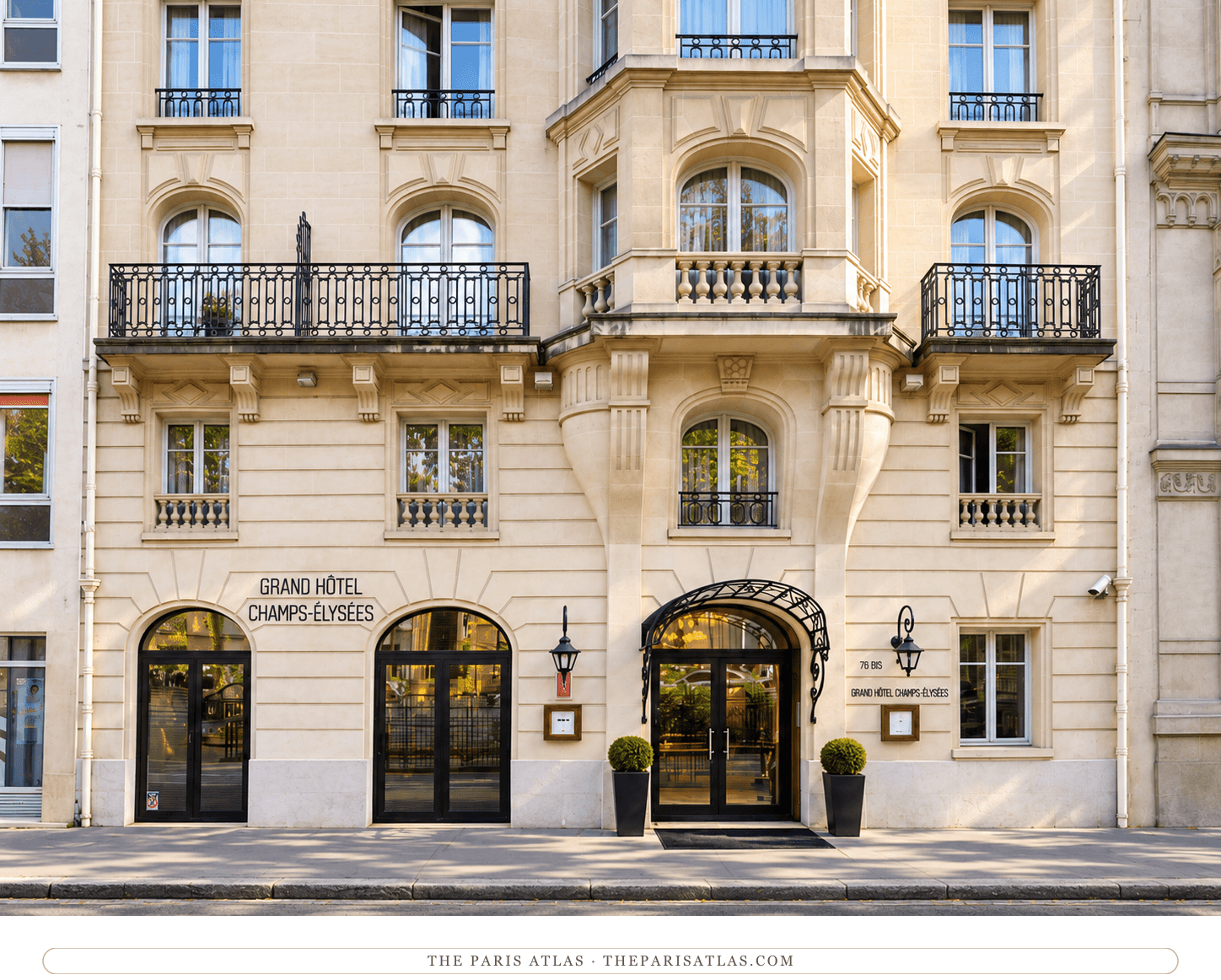Photorealistic illustration of Grand Hôtel Champs-Élysées, with an arched entrance canopy, cream stonework and black iron balconies.