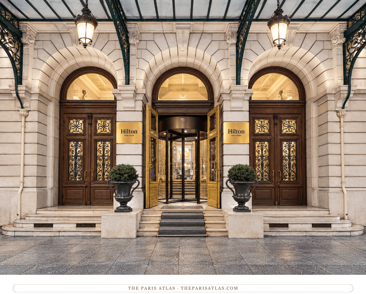 Illustration of Hilton Paris Opéra’s three arched doorways, gilded central entrance and glass canopy.