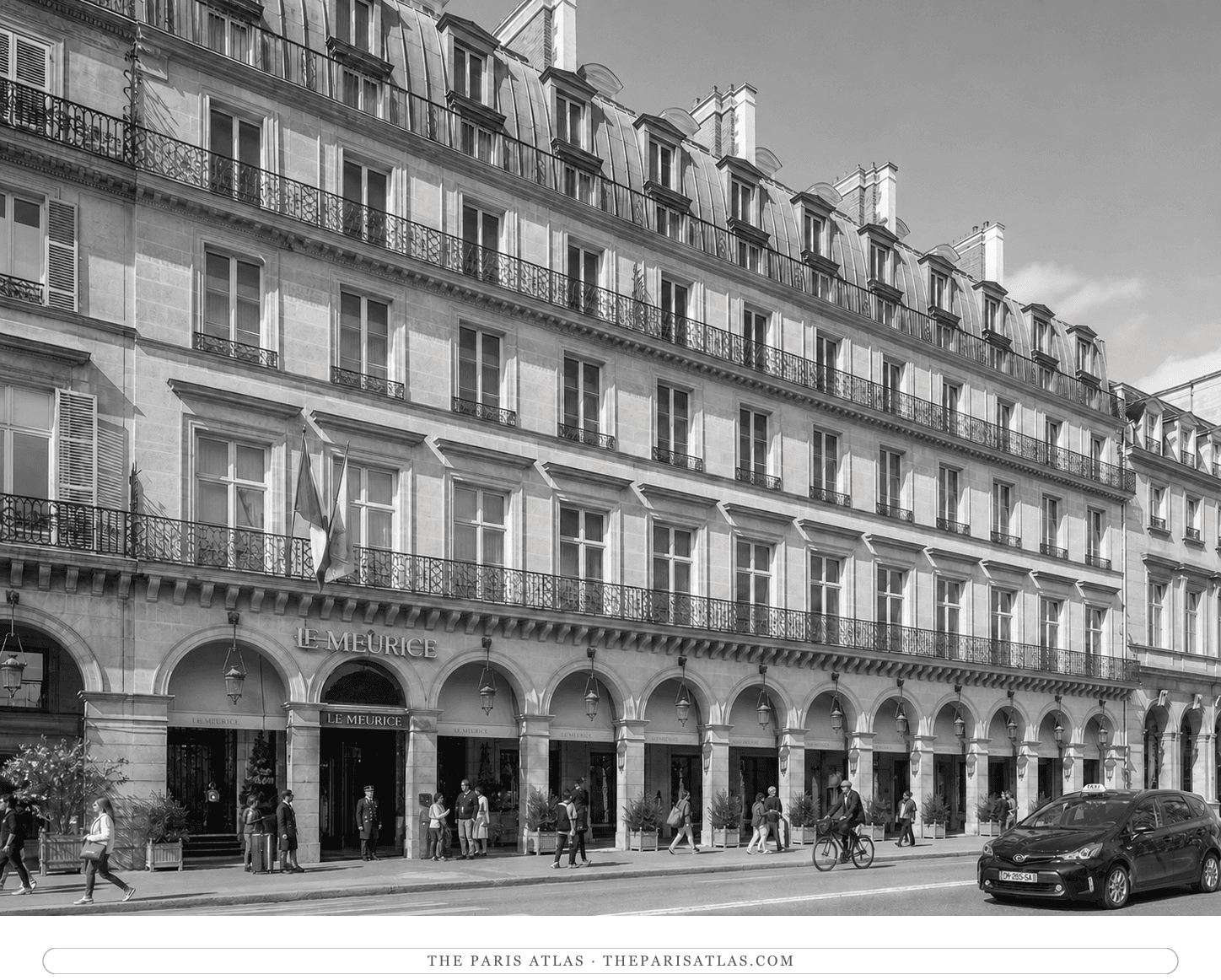 Black-and-white present-day view of Le Meurice beneath the rue de Rivoli arcades