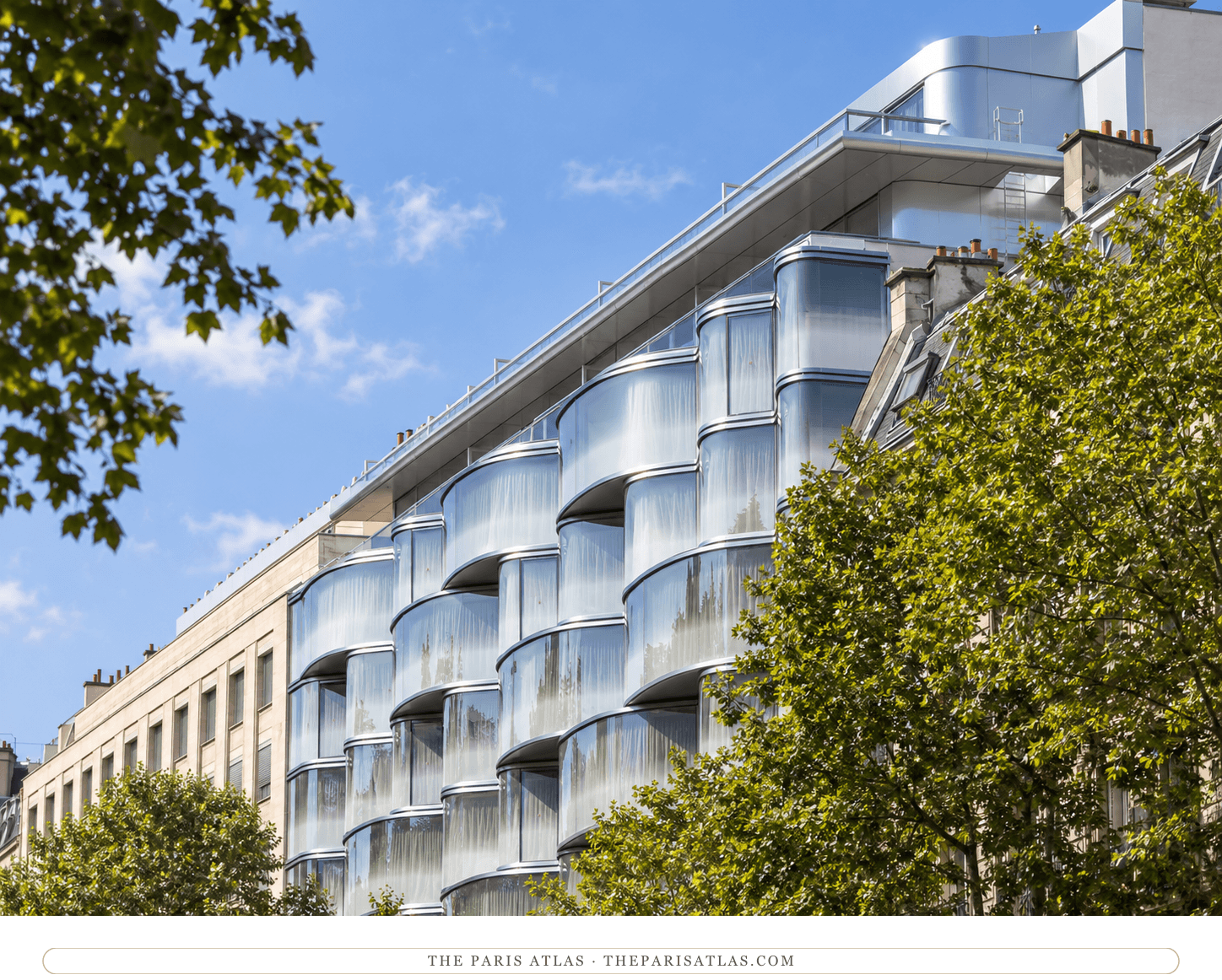 Illustration of curved glass bays with silver horizontal trim, a setback roof terrace and leafy street trees.