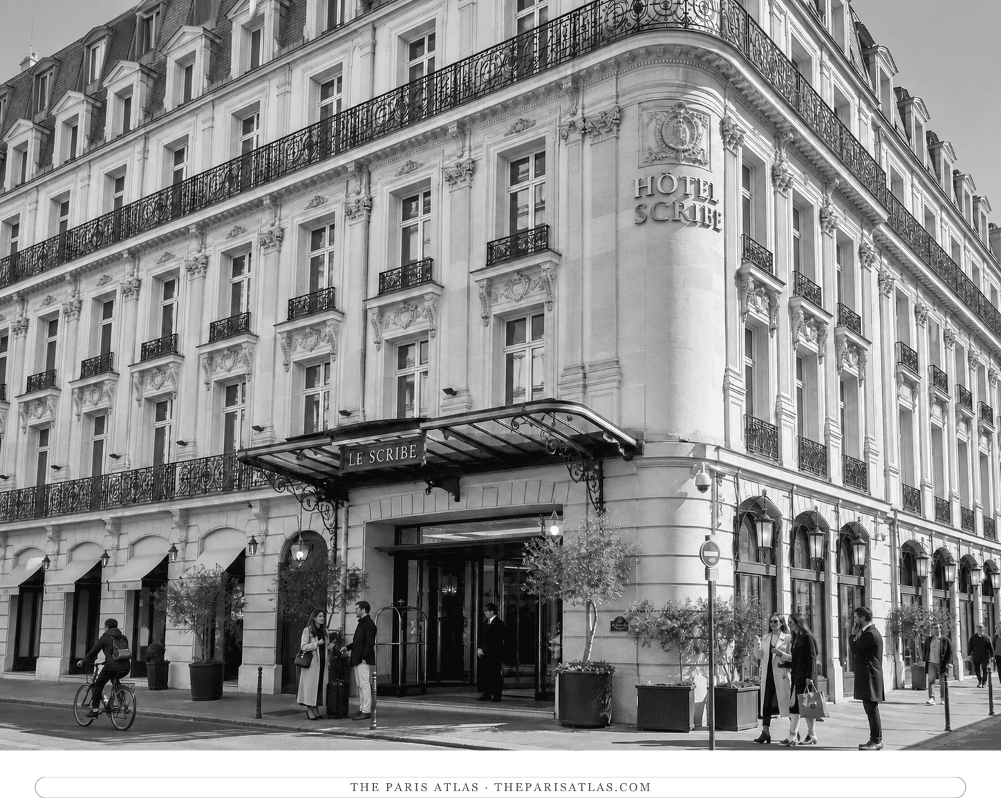 Black-and-white present-day view of guests arriving at Hôtel Scribe near the Opéra
