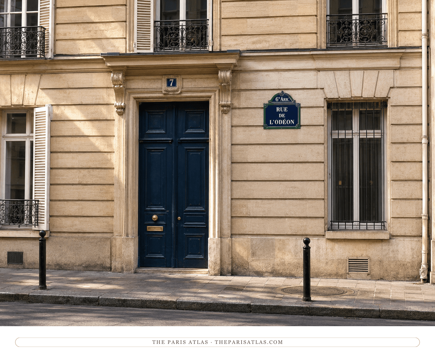 7 rue de l'Odéon today — pale stone, deep-blue paneled doors, and the enamel street plaque reading Rue de l'Odéon